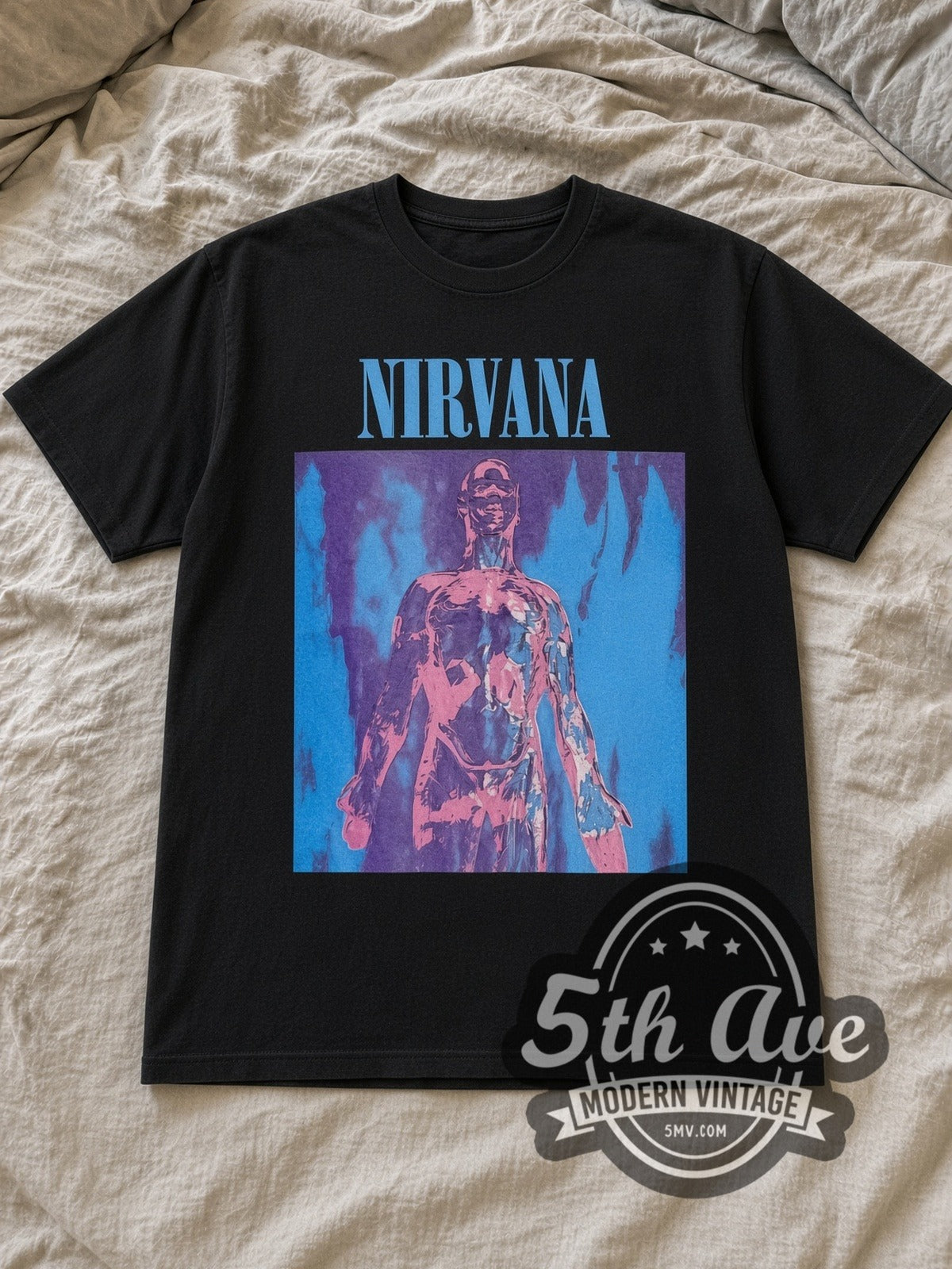 Black Nirvana Sliver Anatomical Figure Charcoal Vintage Band T-Shirt laid flat on a linen bed