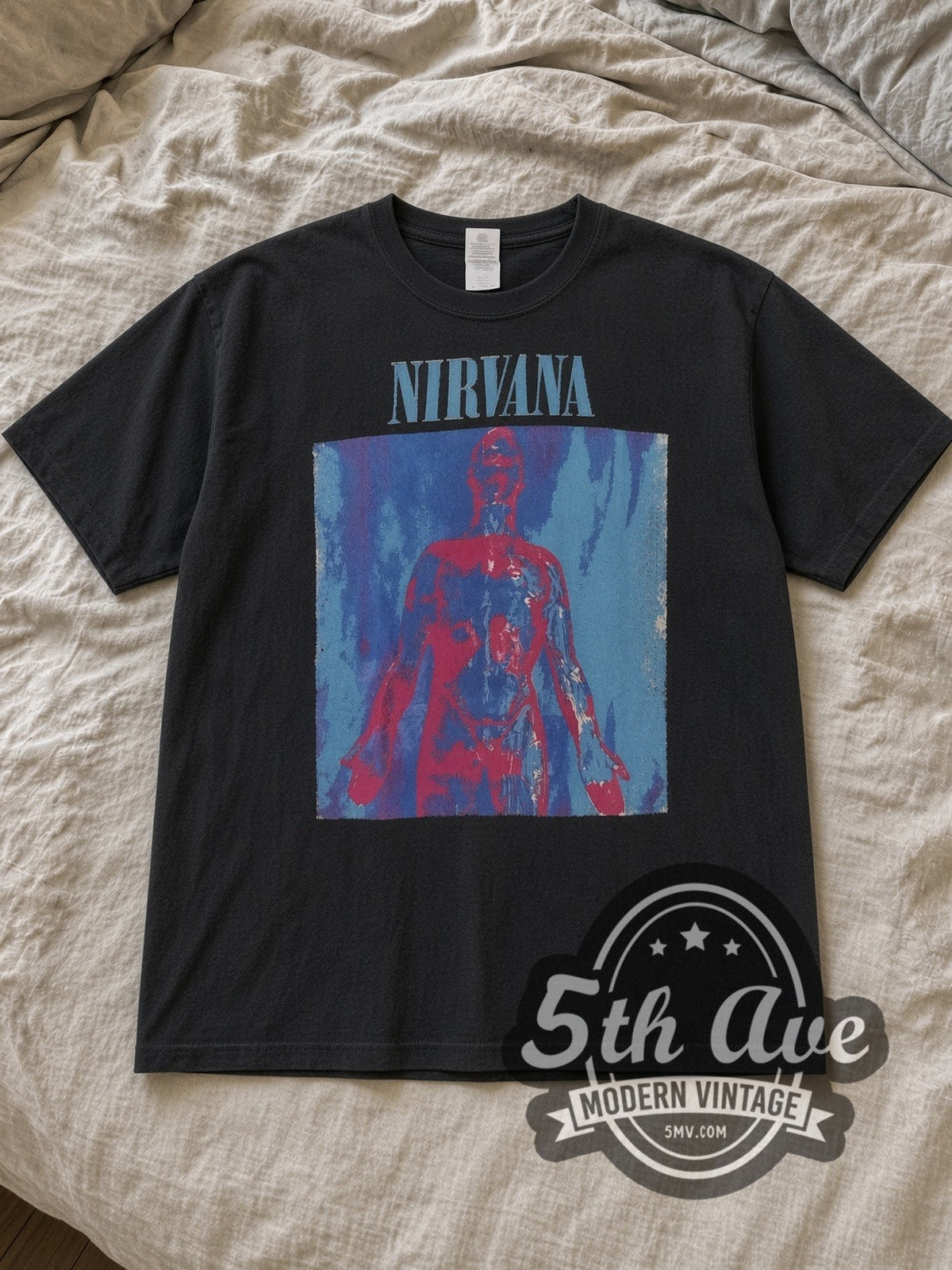 Black Nirvana Sliver Front and Back Print Vintage Band T-Shirt laid flat on a linen bed