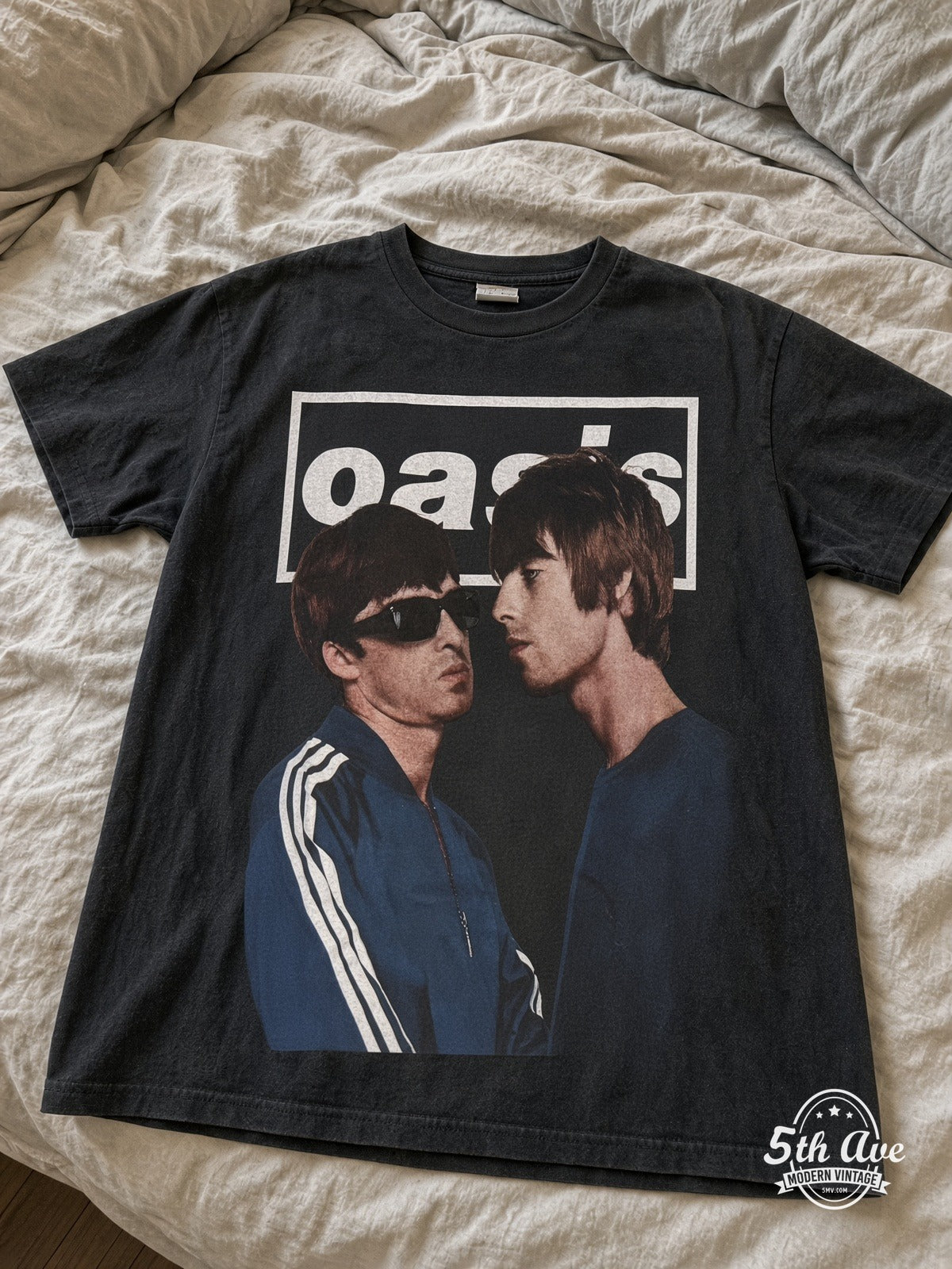 Oasis 1991-2009 Gallagher Portraits vintage tee laid on bed