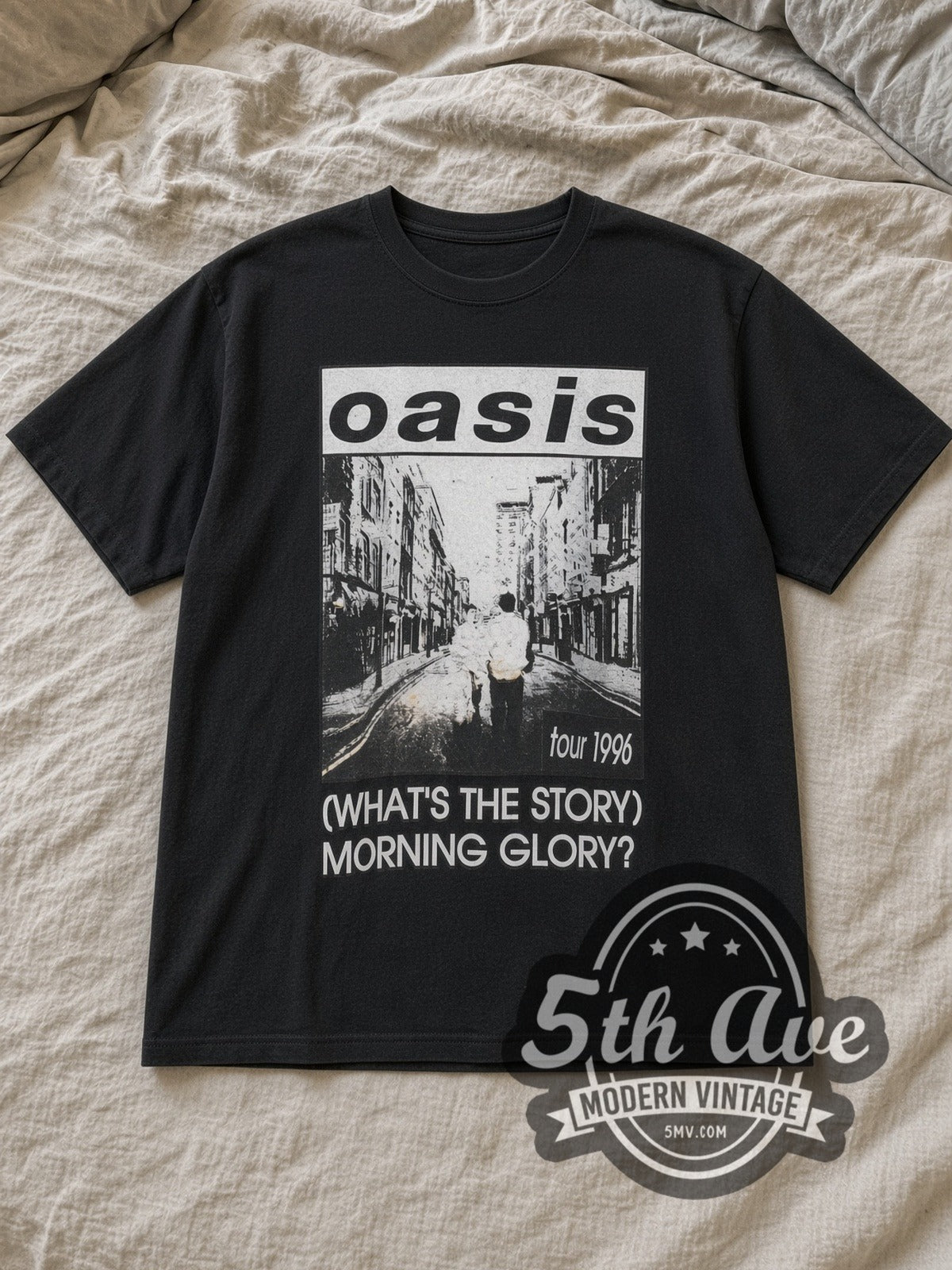 Black Oasis Morning Glory Berwick Street Tour 1996 Vintage Band T-Shirt laid flat on a linen bed