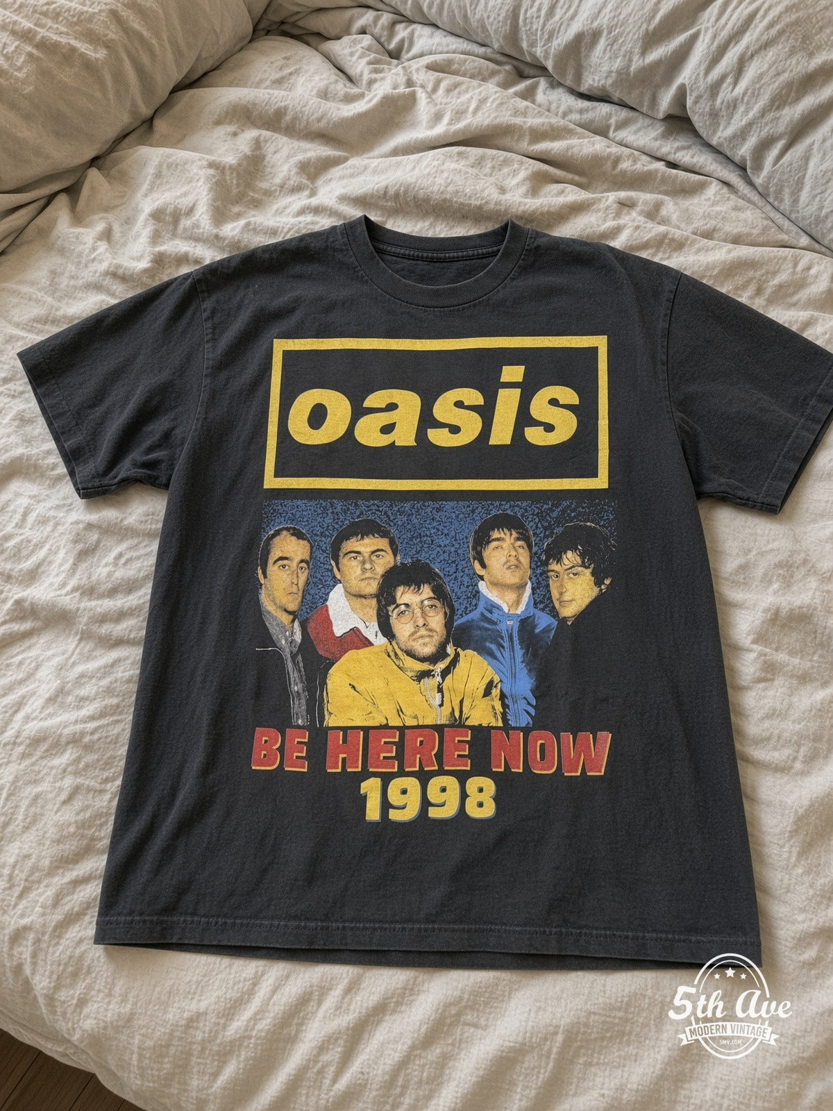 Oasis Be Here Now Tour 1998 vintage tee laid on bed