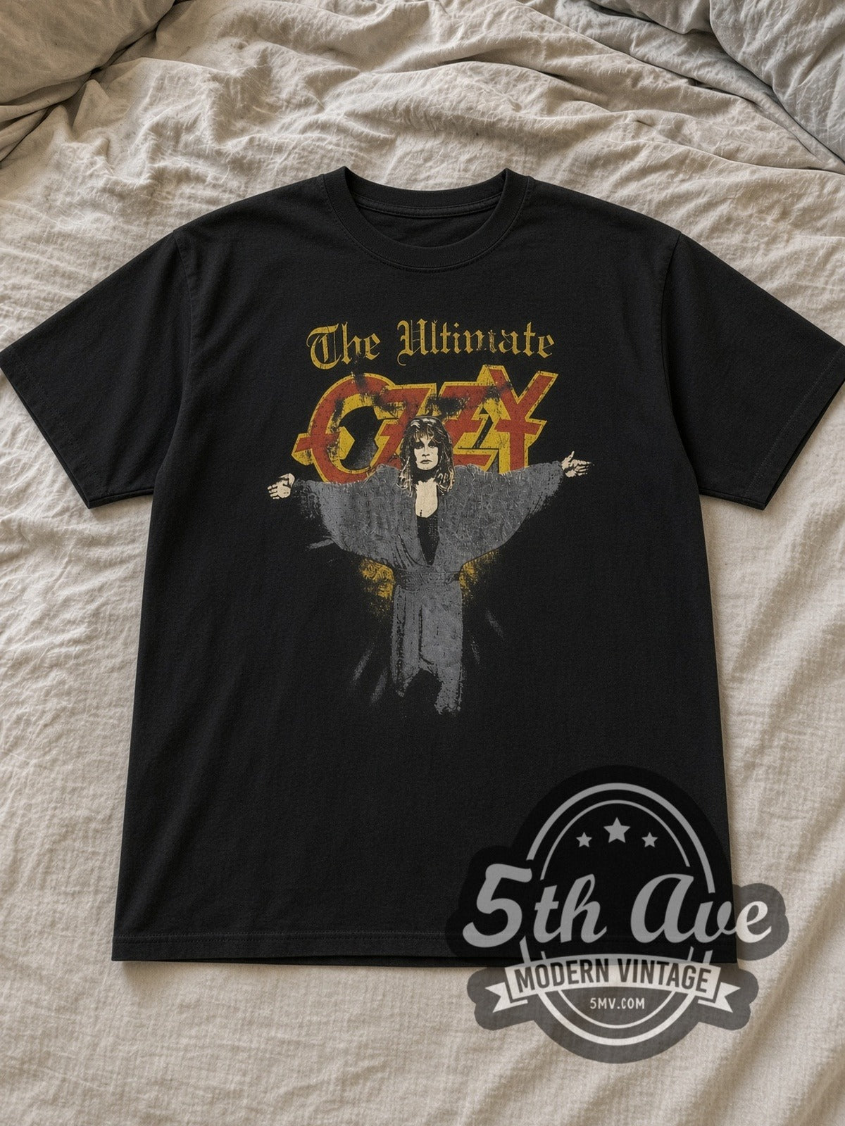 Black Ozzy Osbourne The Ultimate Vintage Band T-Shirt laid flat on a linen bed
