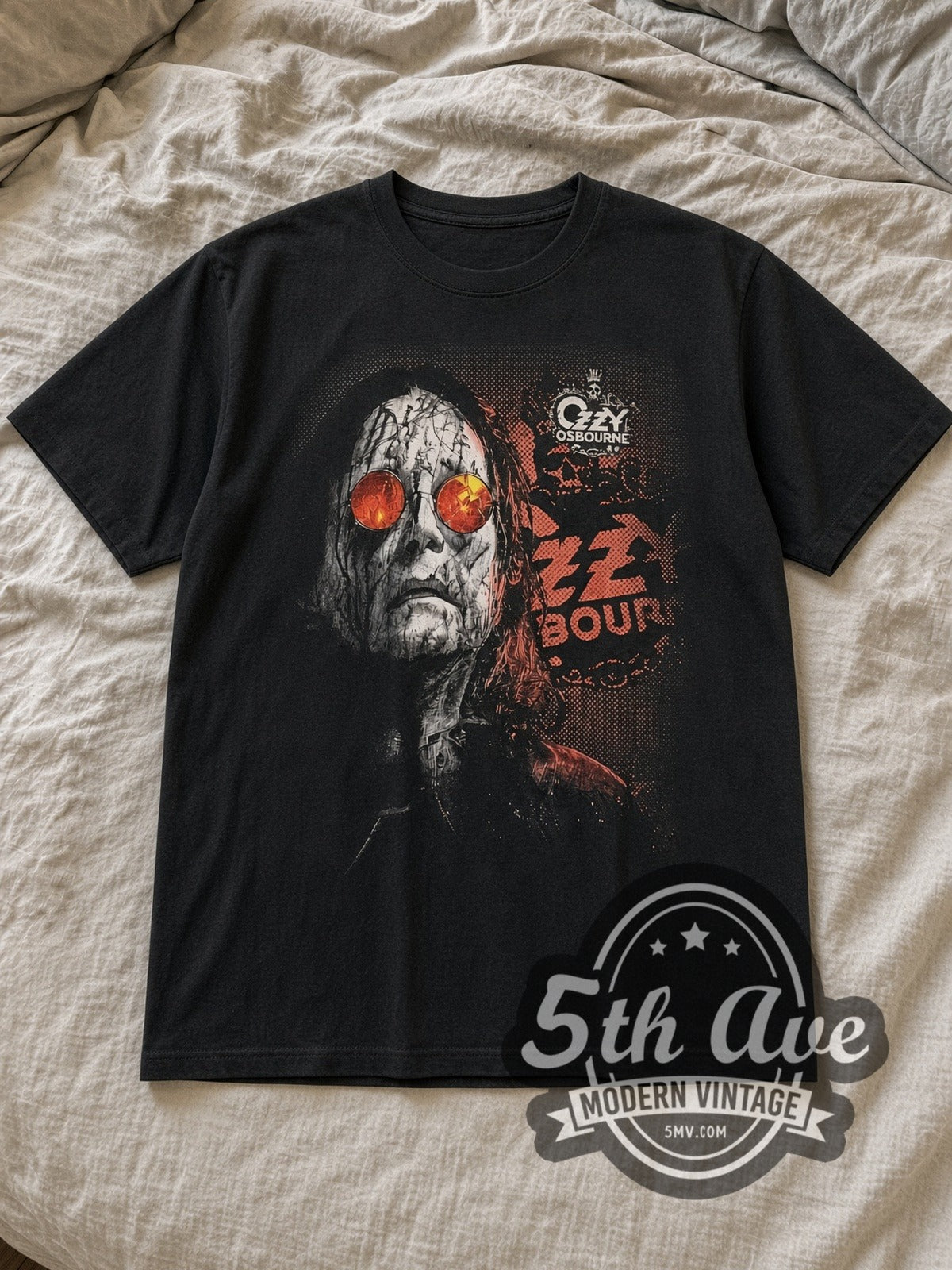 Black Ozzy Osbourne Red Sunglasses Cracked Portrait Vintage Band T-Shirt laid flat on a linen bed