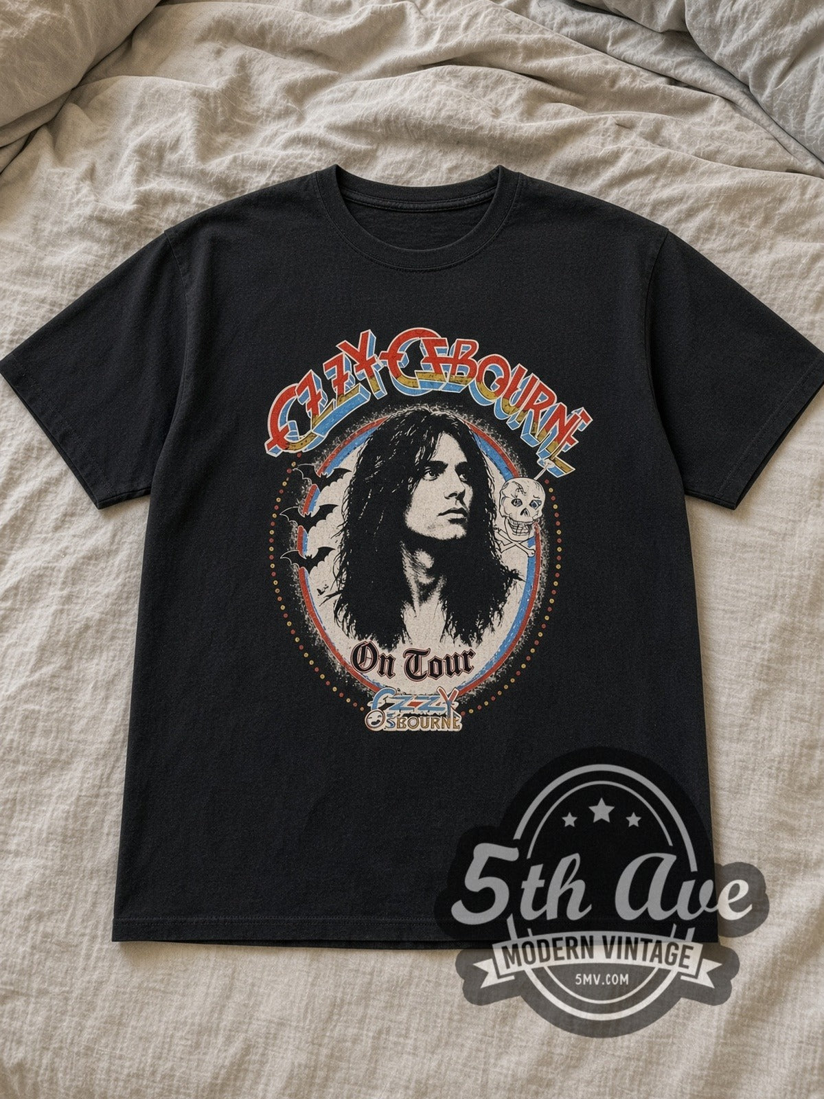 Black Ozzy Osbourne On Tour Vintage Band T-Shirt laid flat on a linen bed