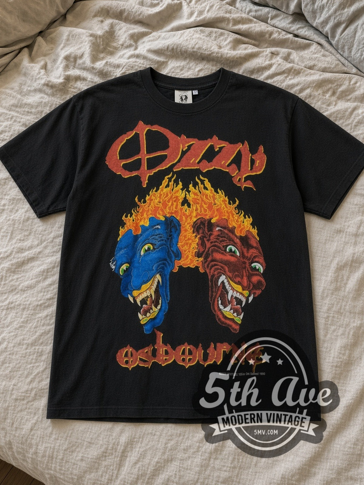 Black Ozzy Osbourne Vintage Band T-Shirt laid flat on a linen bed