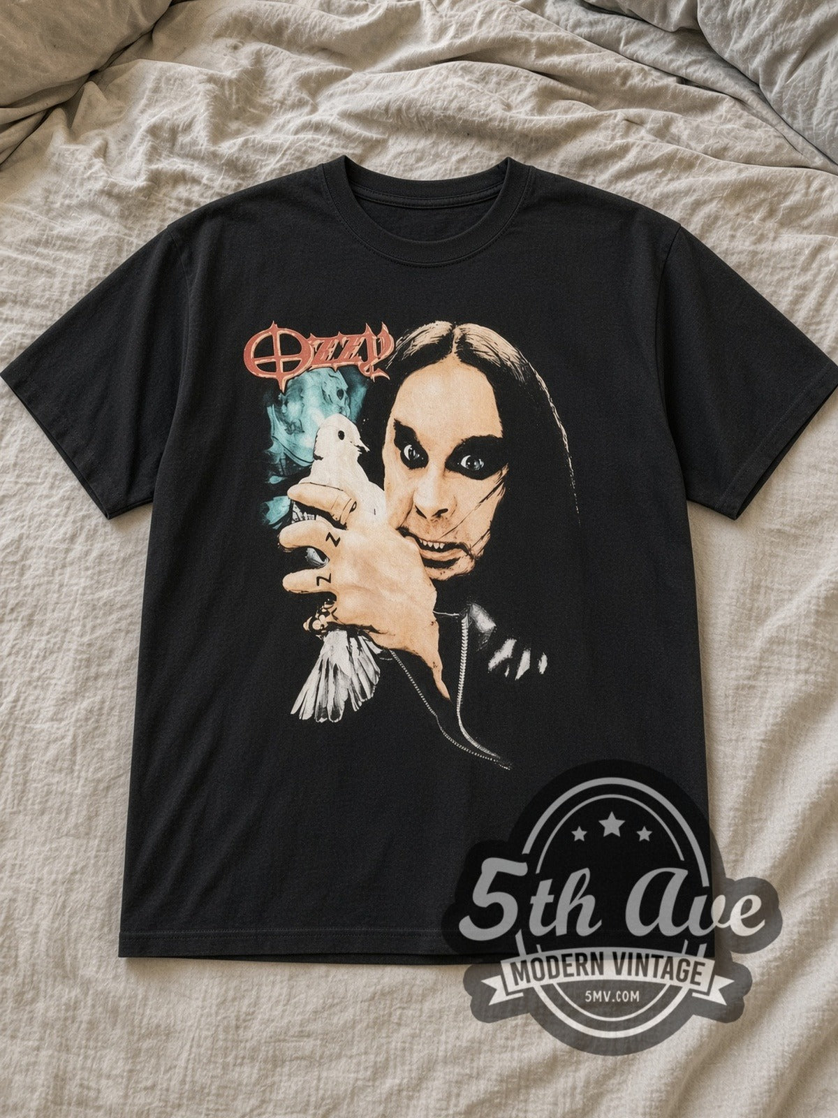 Black Ozzy Osbourne Dove Holding Portrait Moon Vintage Band T-Shirt laid flat on a linen bed