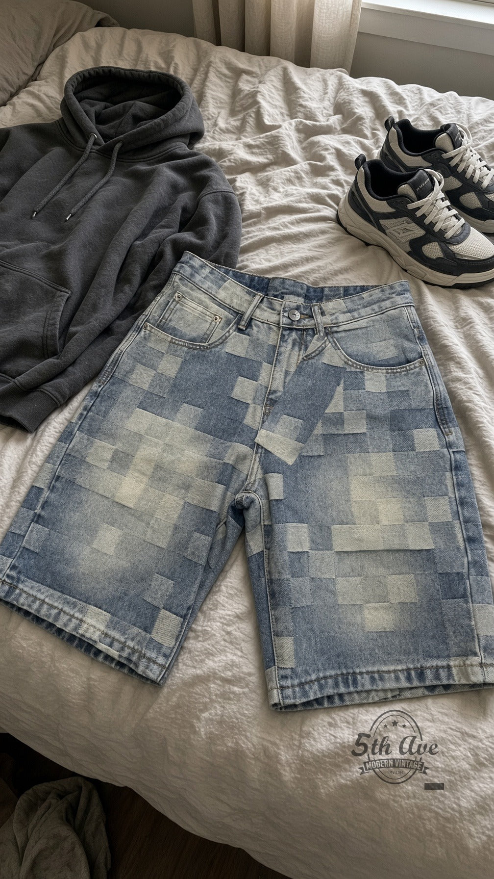 Pixel Grid Digital Checker Jorts laid on bed