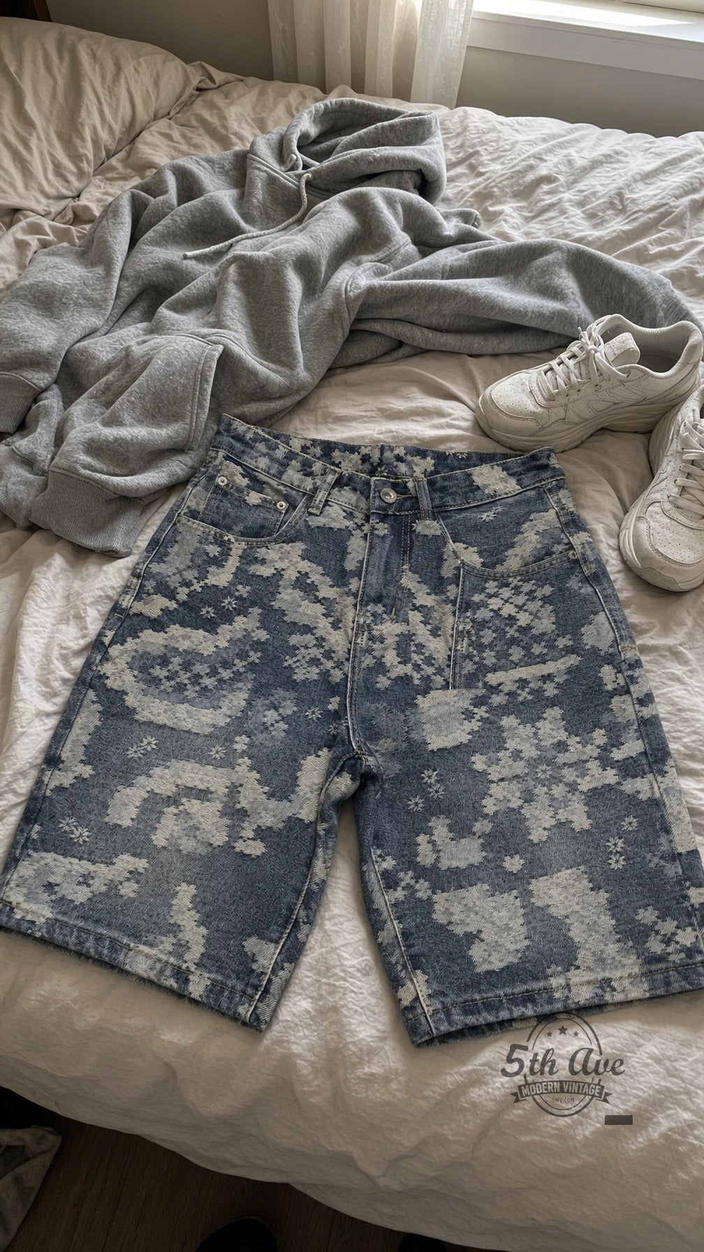 Indigo Pixel Star Print Jorts laid on bed