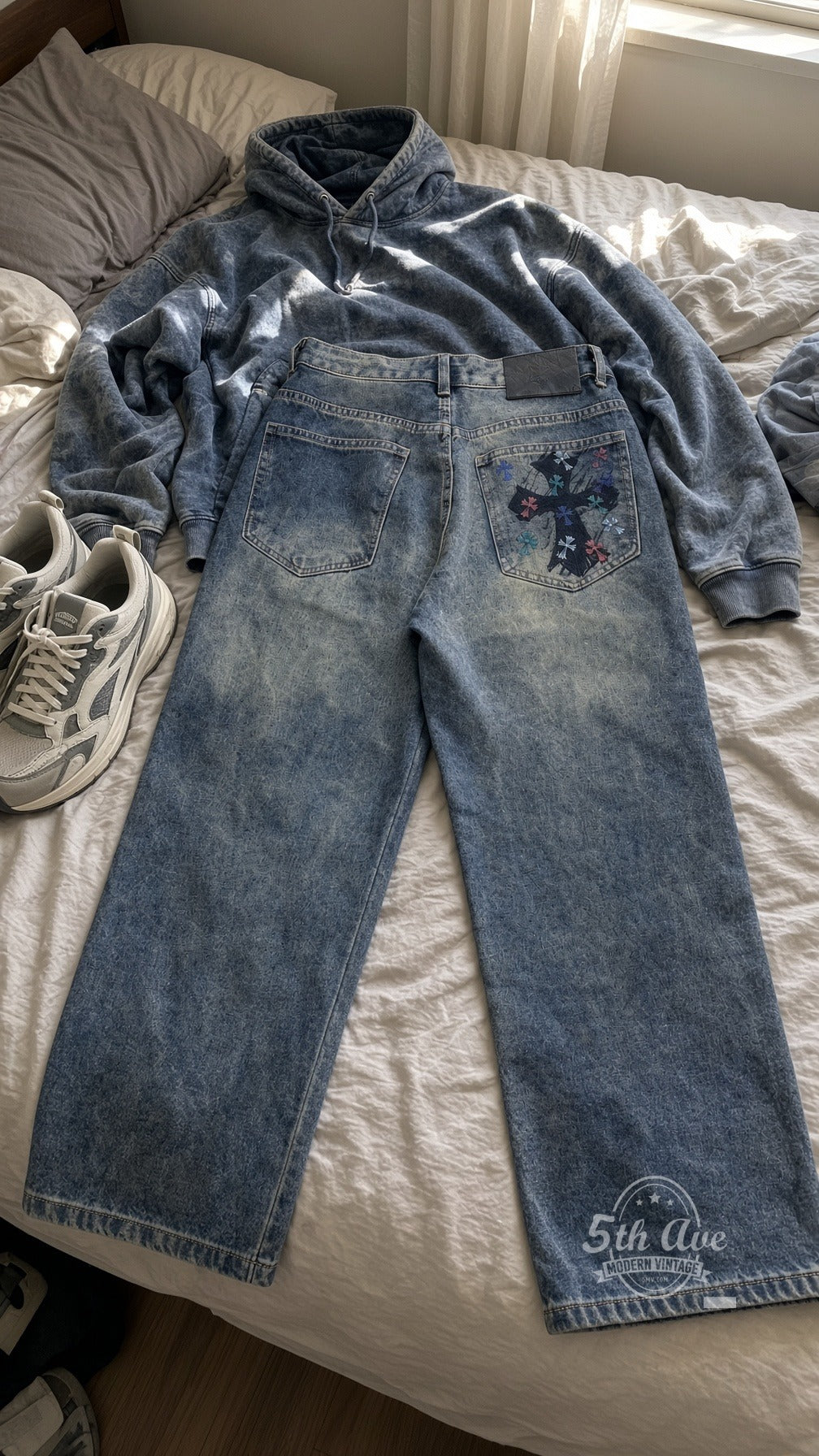 Acid Wash Multi-Color Cross Back Pocket Streetwear Jeans laid on bed