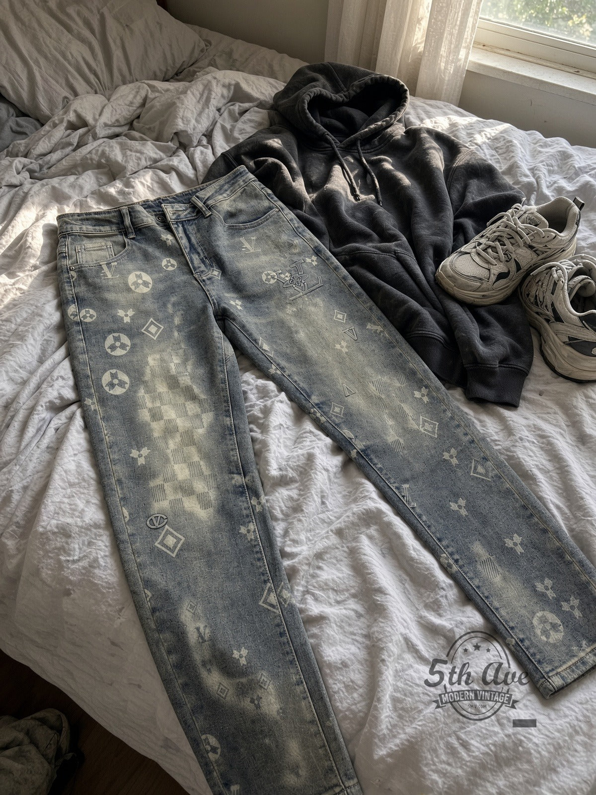 Acid Wash Monogram-Style Streetwear Jeans laid on bed