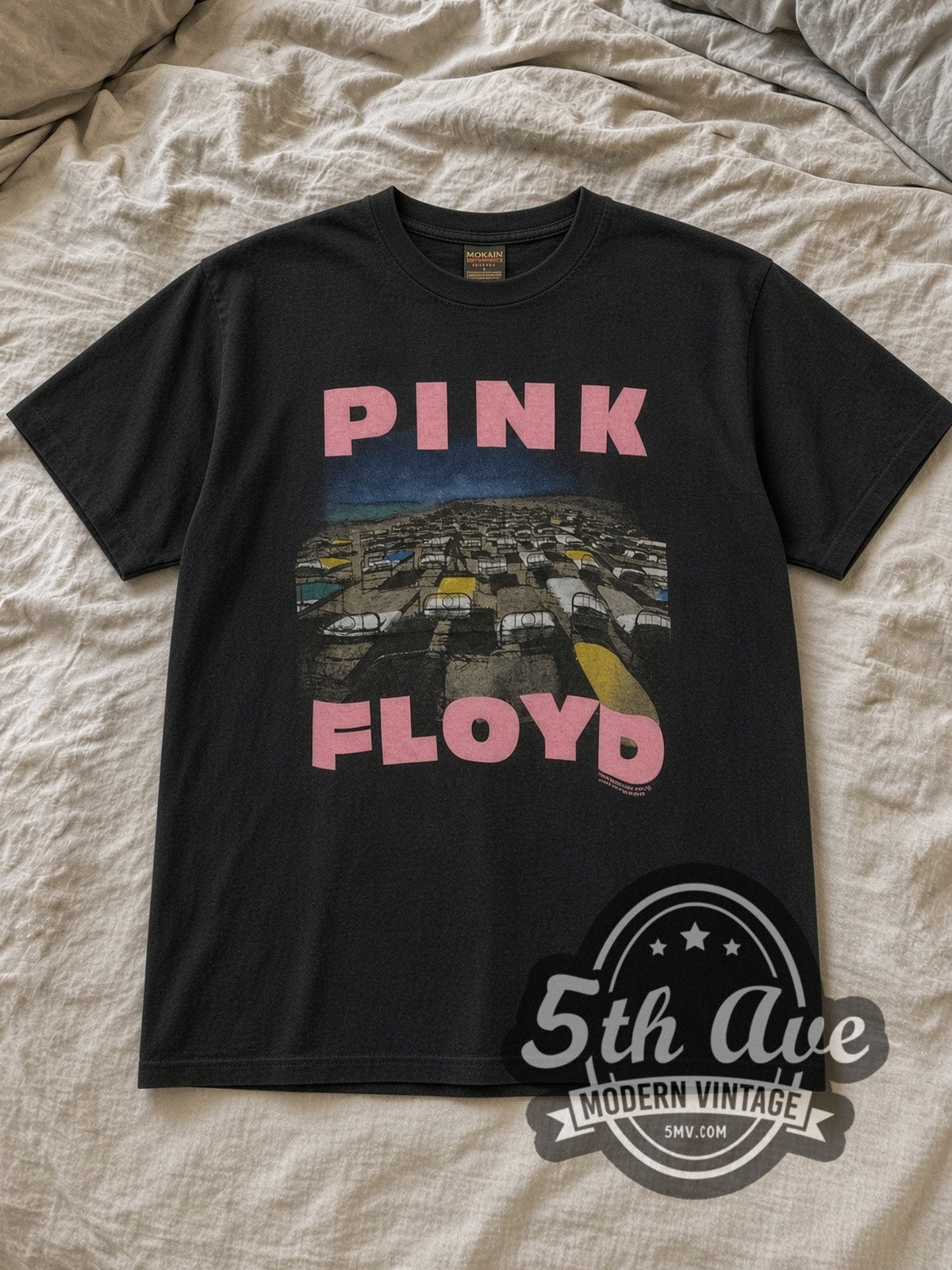 Black Pink Floyd Momentary Lapse of Reason Beds Vintage Band T-Shirt laid flat on a linen bed