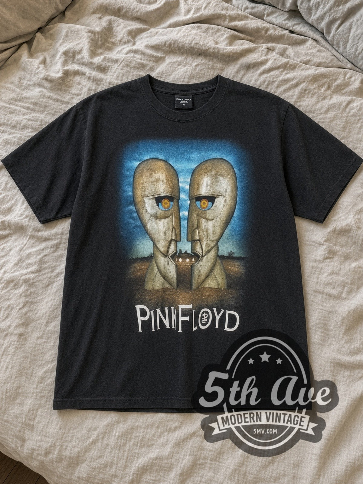 Black Pink Floyd North American Tour 1994 Vintage Band T-Shirt laid flat on a linen bed