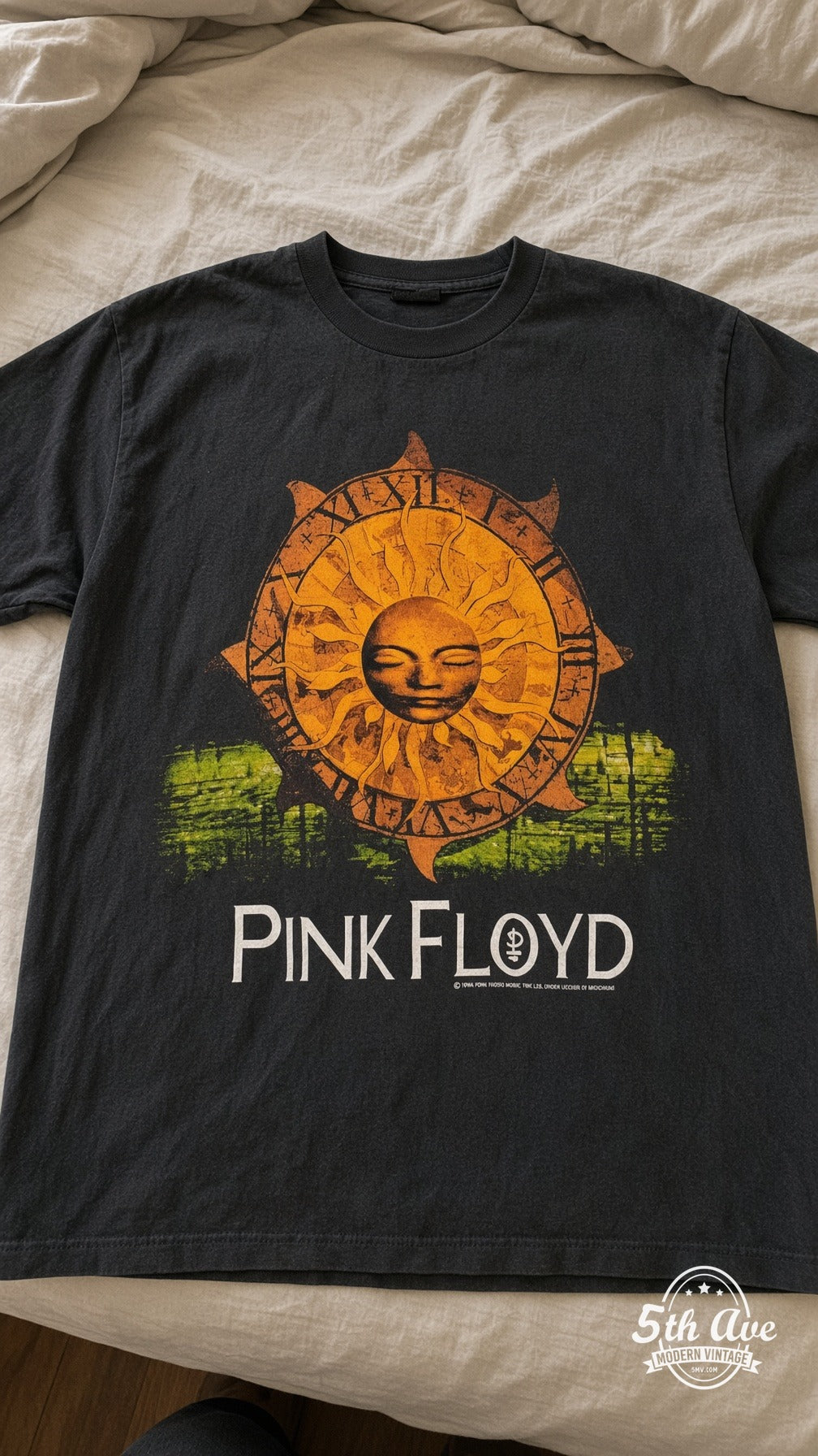 Pink Floyd vintage t-shirt laid on bed