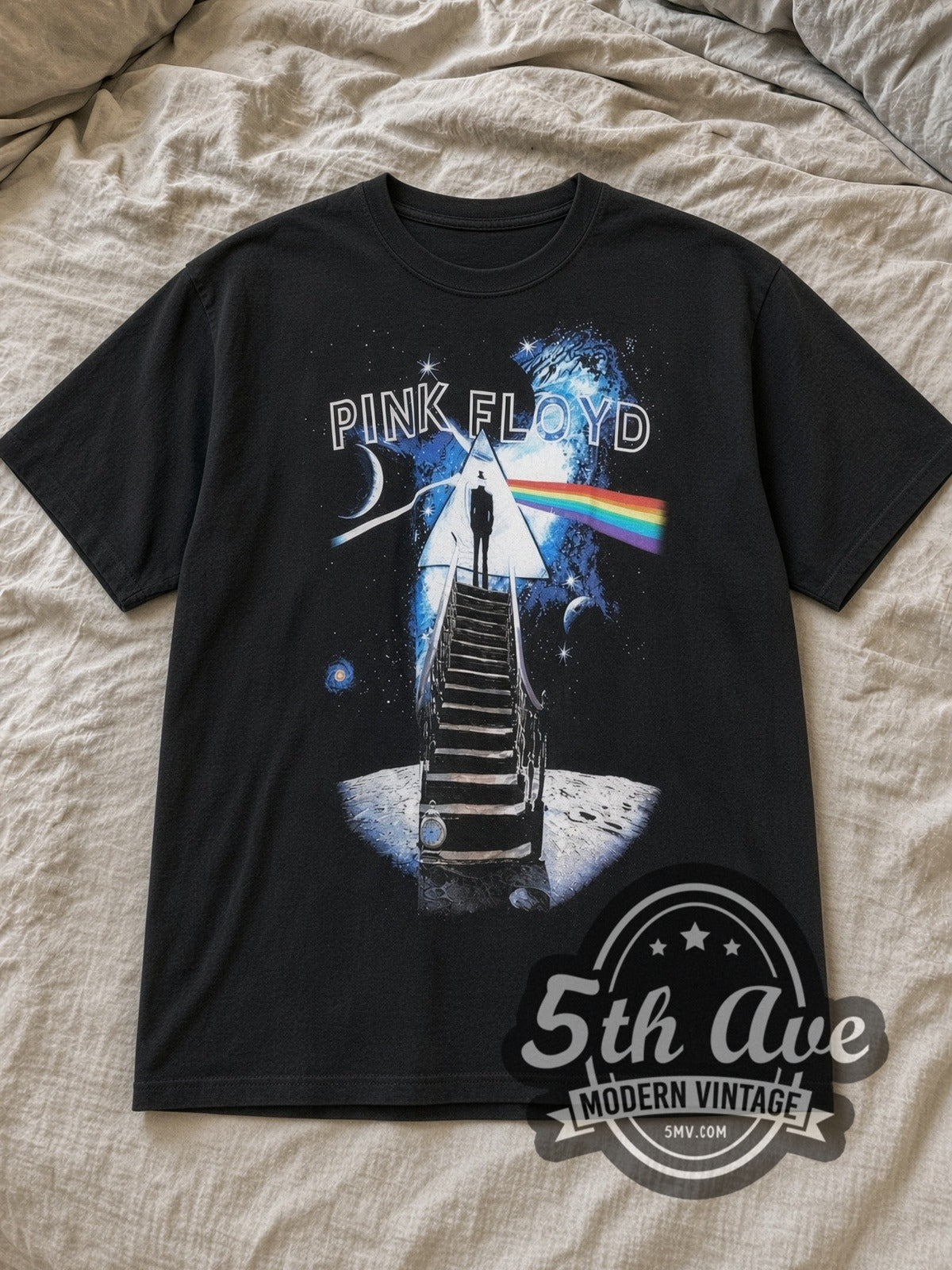Black Pink Floyd Stairway Pyramid Moon Spectrum Vintage Band T-Shirt laid flat on a linen bed