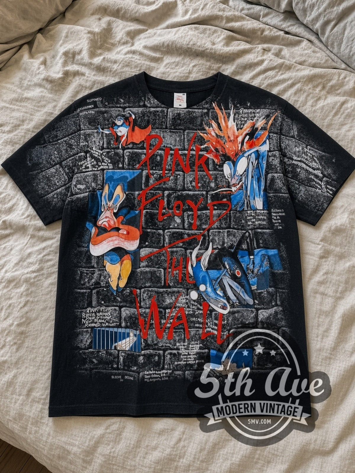 Black Pink Floyd The Wall Brick Characters All Over Print Vintage Band T-Shirt laid flat on a linen bed