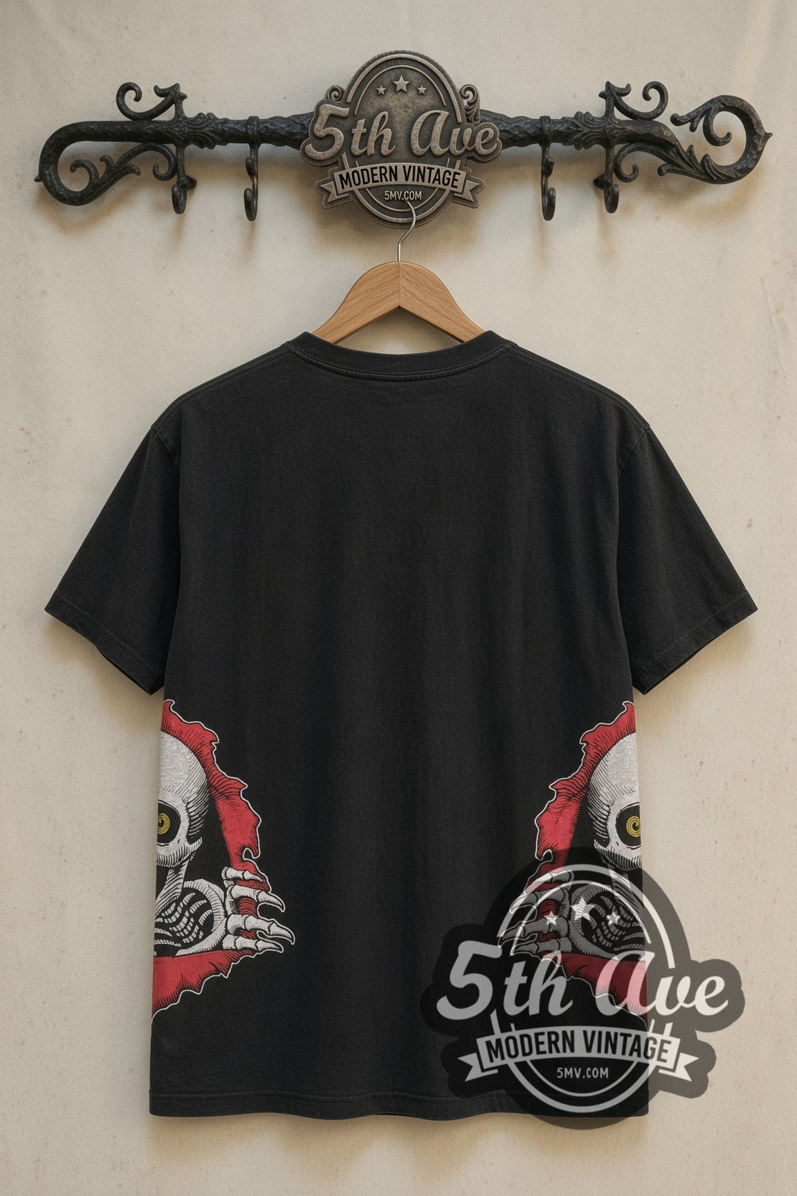 Powell Peralta tee back with Ripper skulls tearing through both side seams on rack
