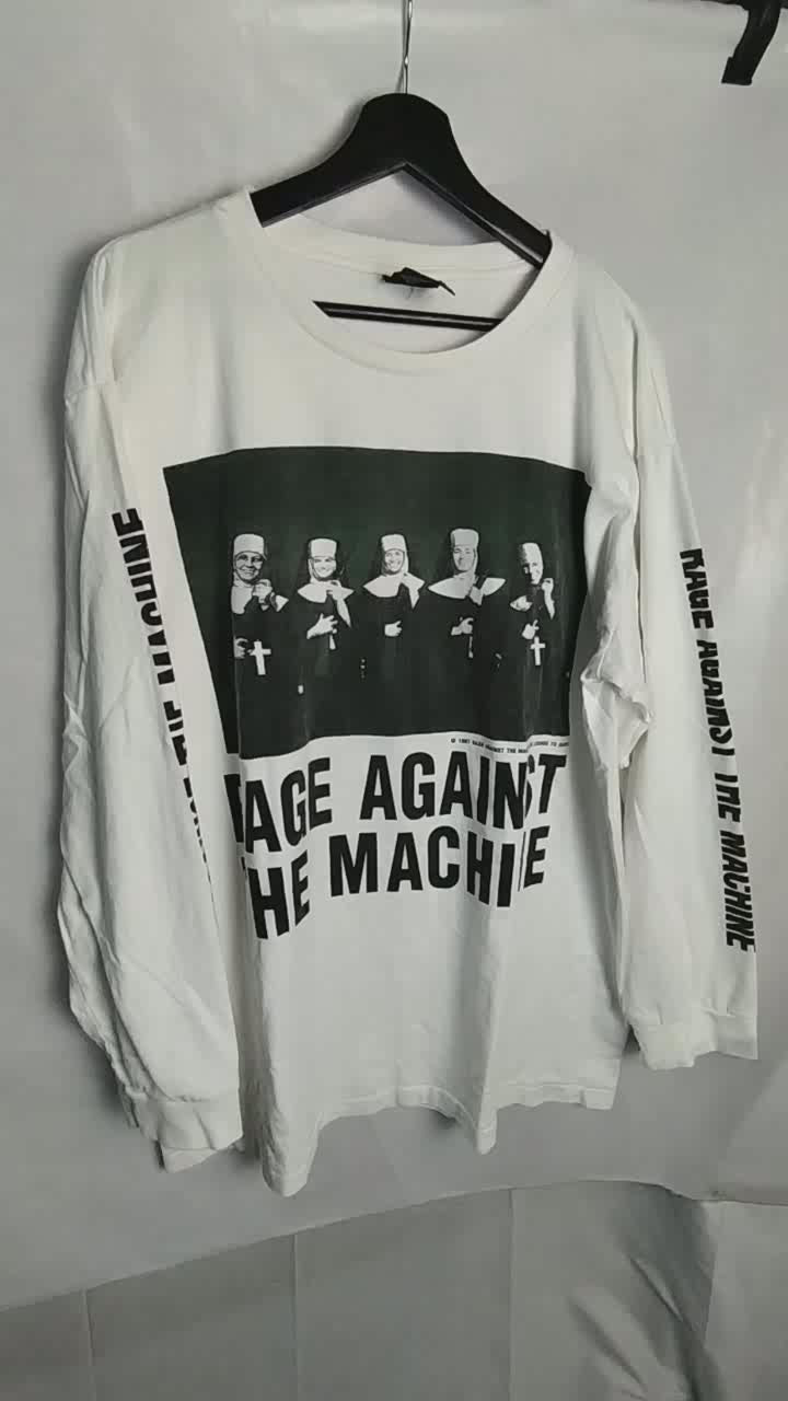 A video showing the front and the back of the rage against the machine nuns with guns t shirt