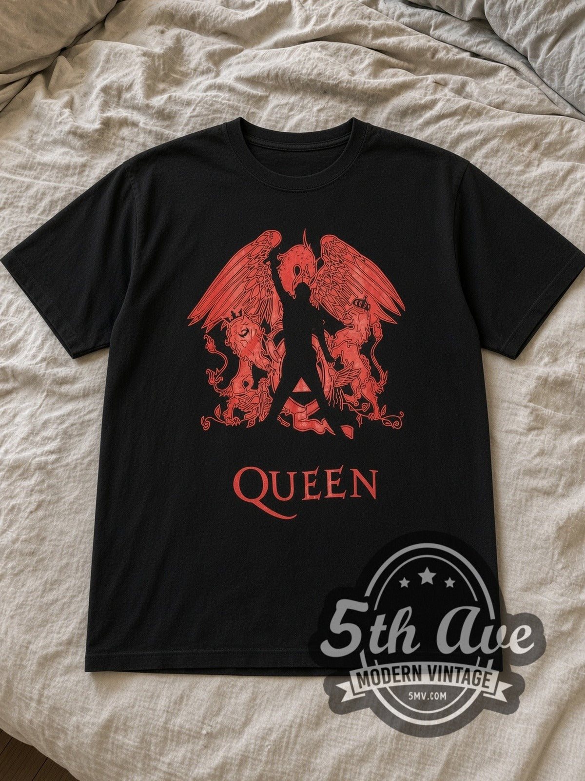 Black Queen Red Freddie Silhouette Crest Vintage Band T-Shirt laid flat on a linen bed