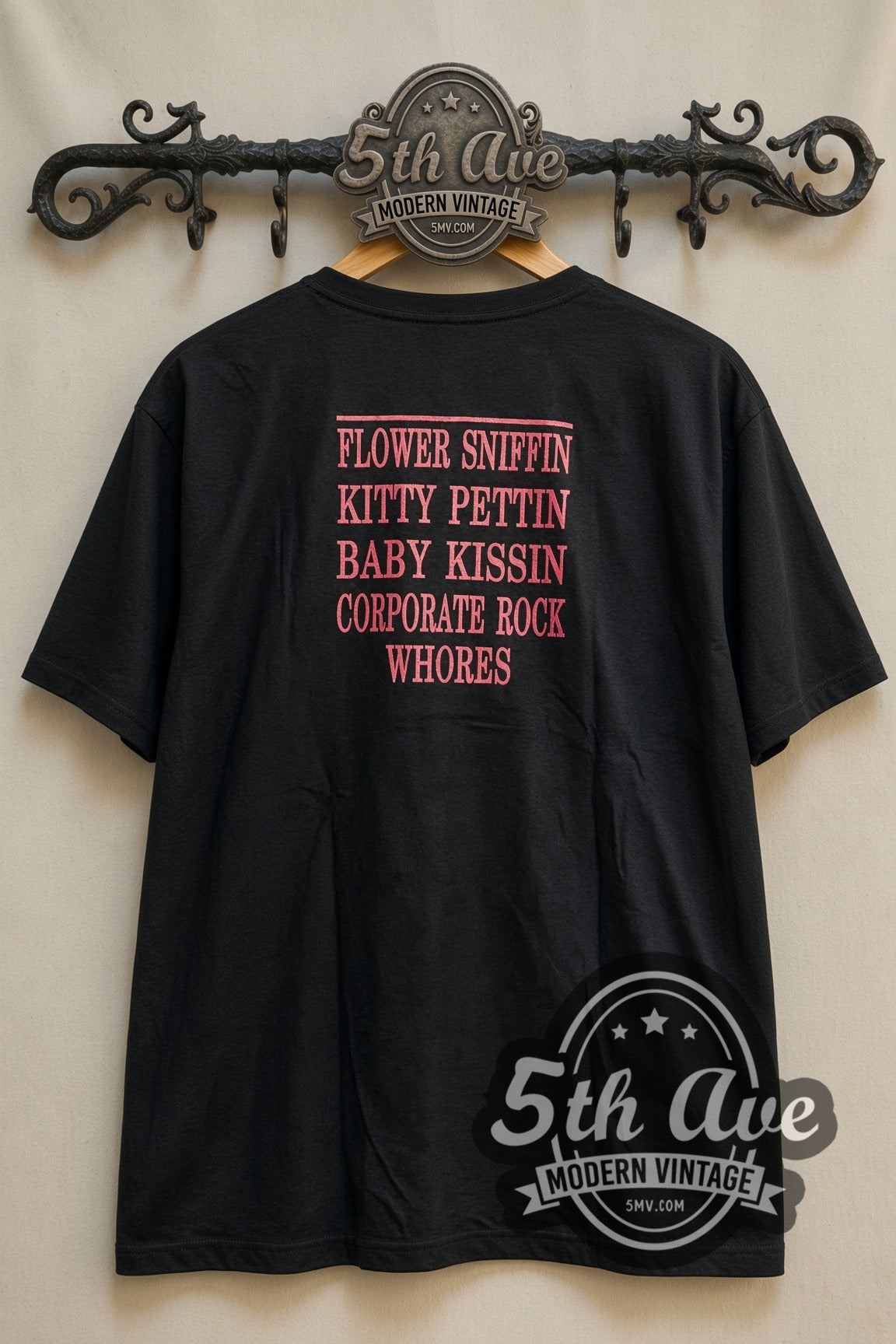 Nirvana Red Smiley Face Logo vintage band t-shirt, back view on a display rack