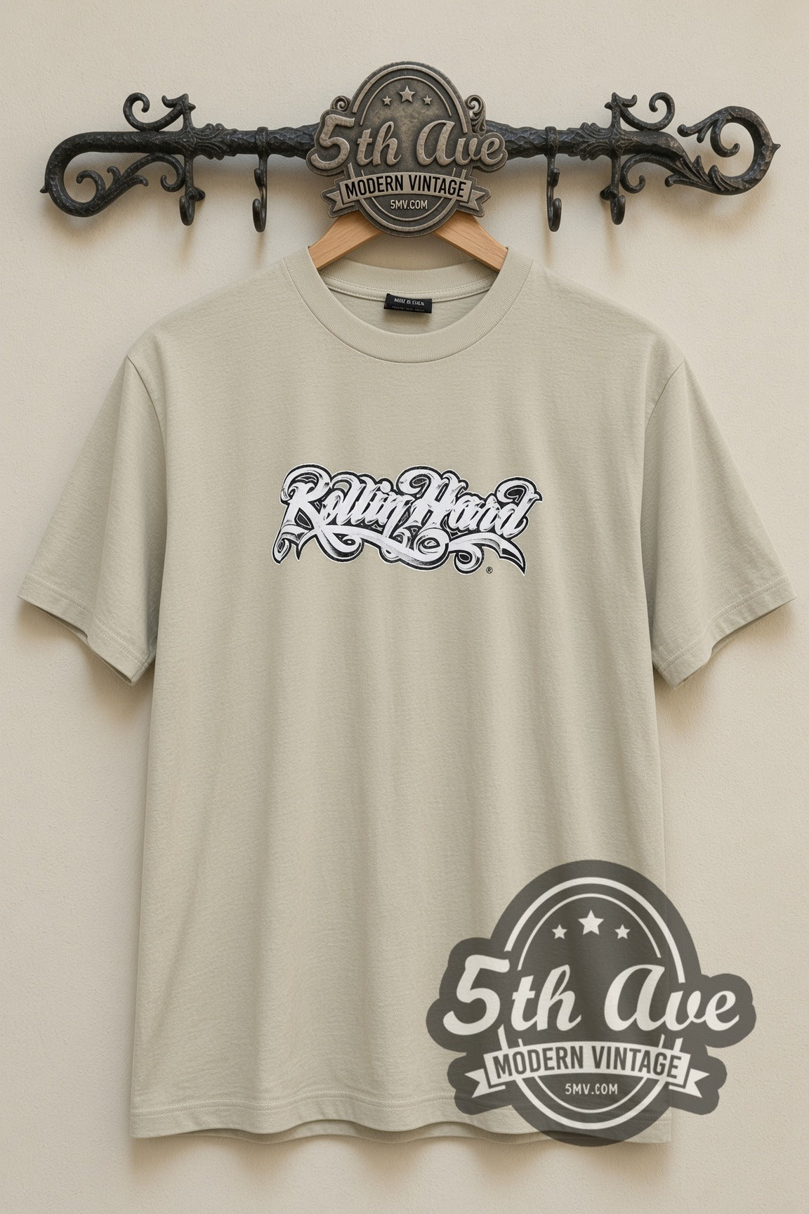 Rollin Hard Heartbreaker Lowrider vintage graphic tee in sand, back view on a display rack