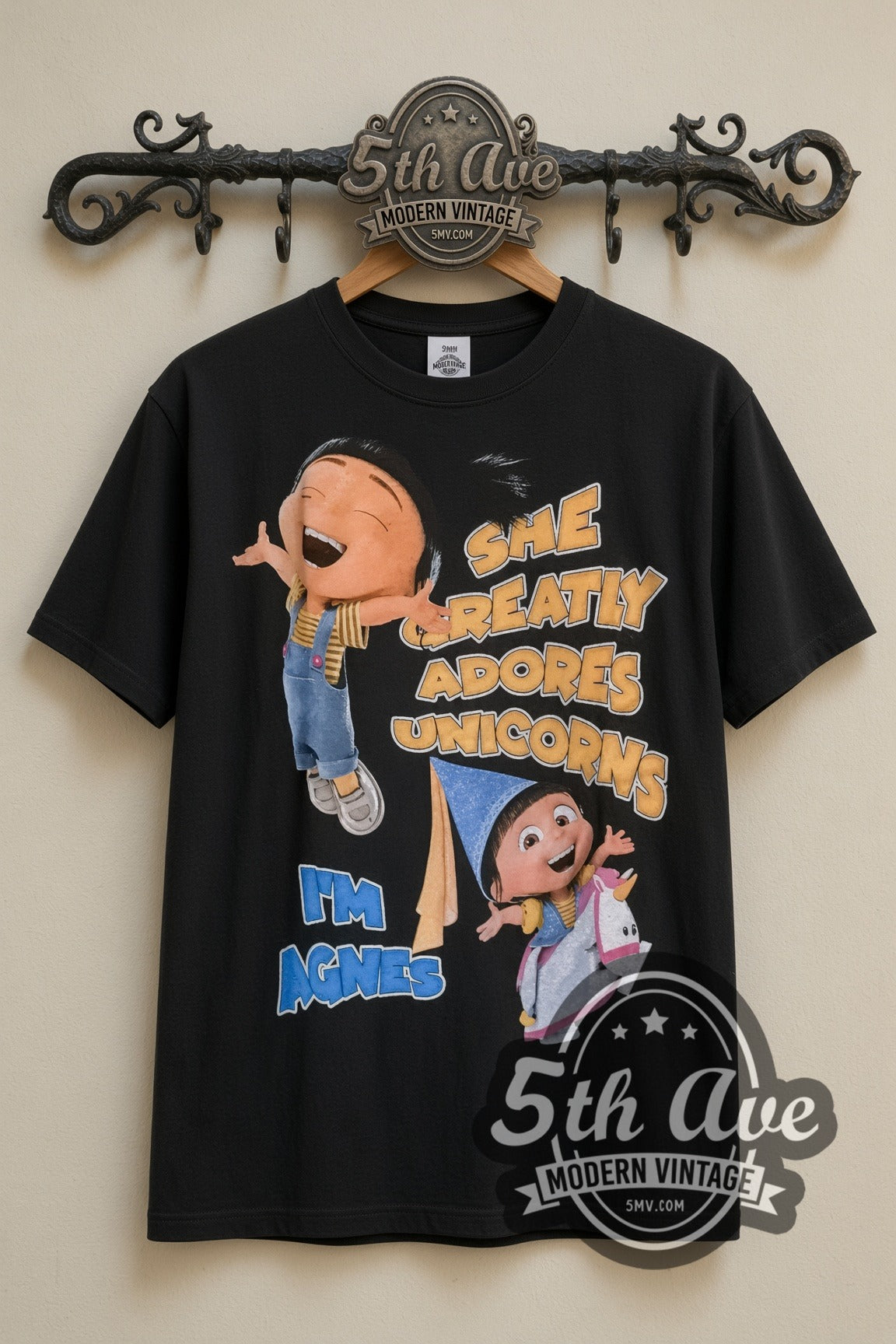 Despicable Me Agnes and Her Unicorn Adventure vintage cartoon tee, back view on a display rack
