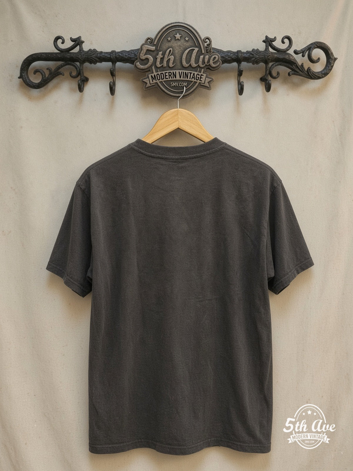 Discharge Tributo Punk Rock Legends t shirt – Vintage Band T-Shirt — back on locked cream ornate 5th Ave rack