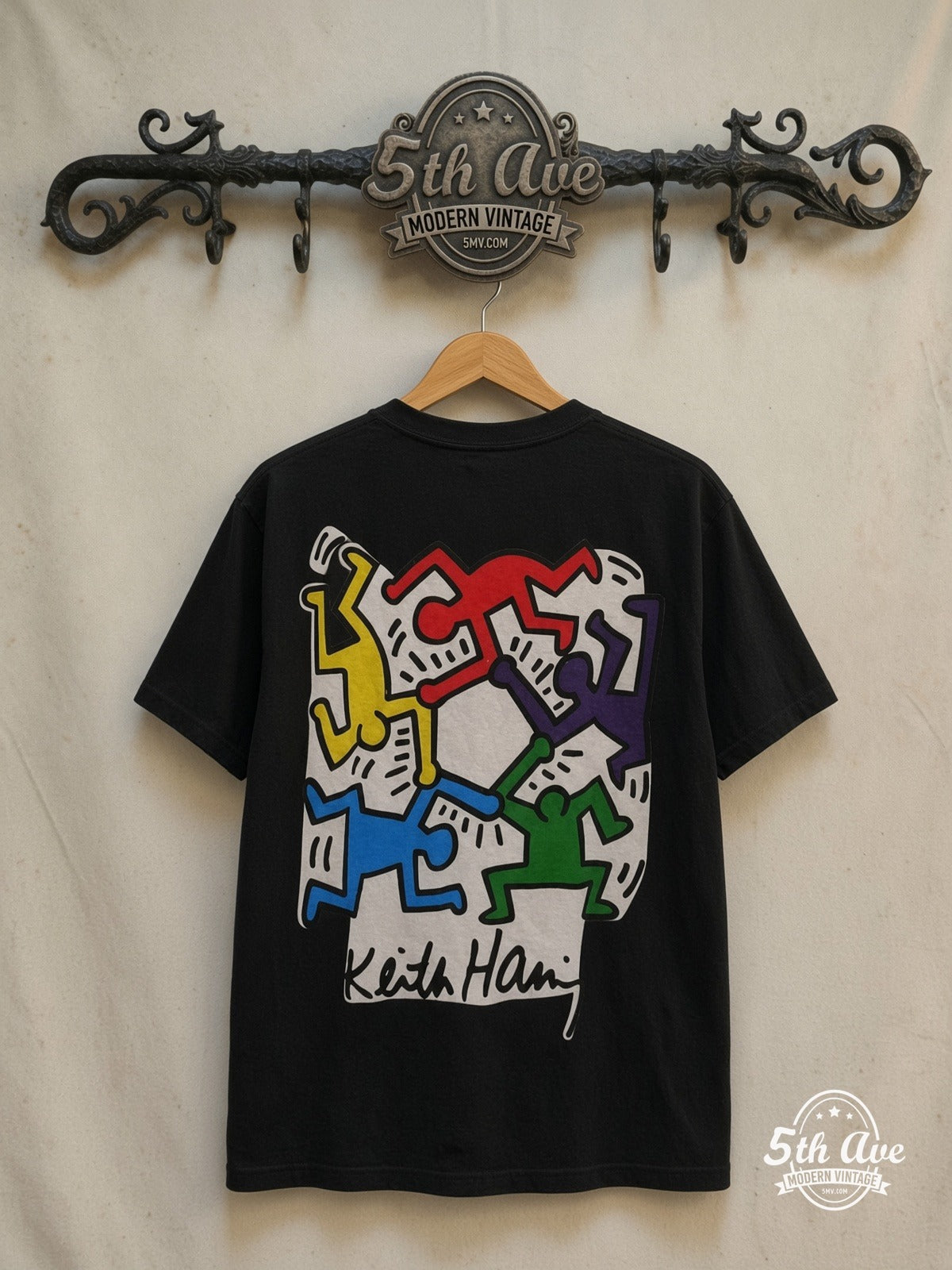 Keith Haring t shirt — back on locked cream ornate 5th Ave rack