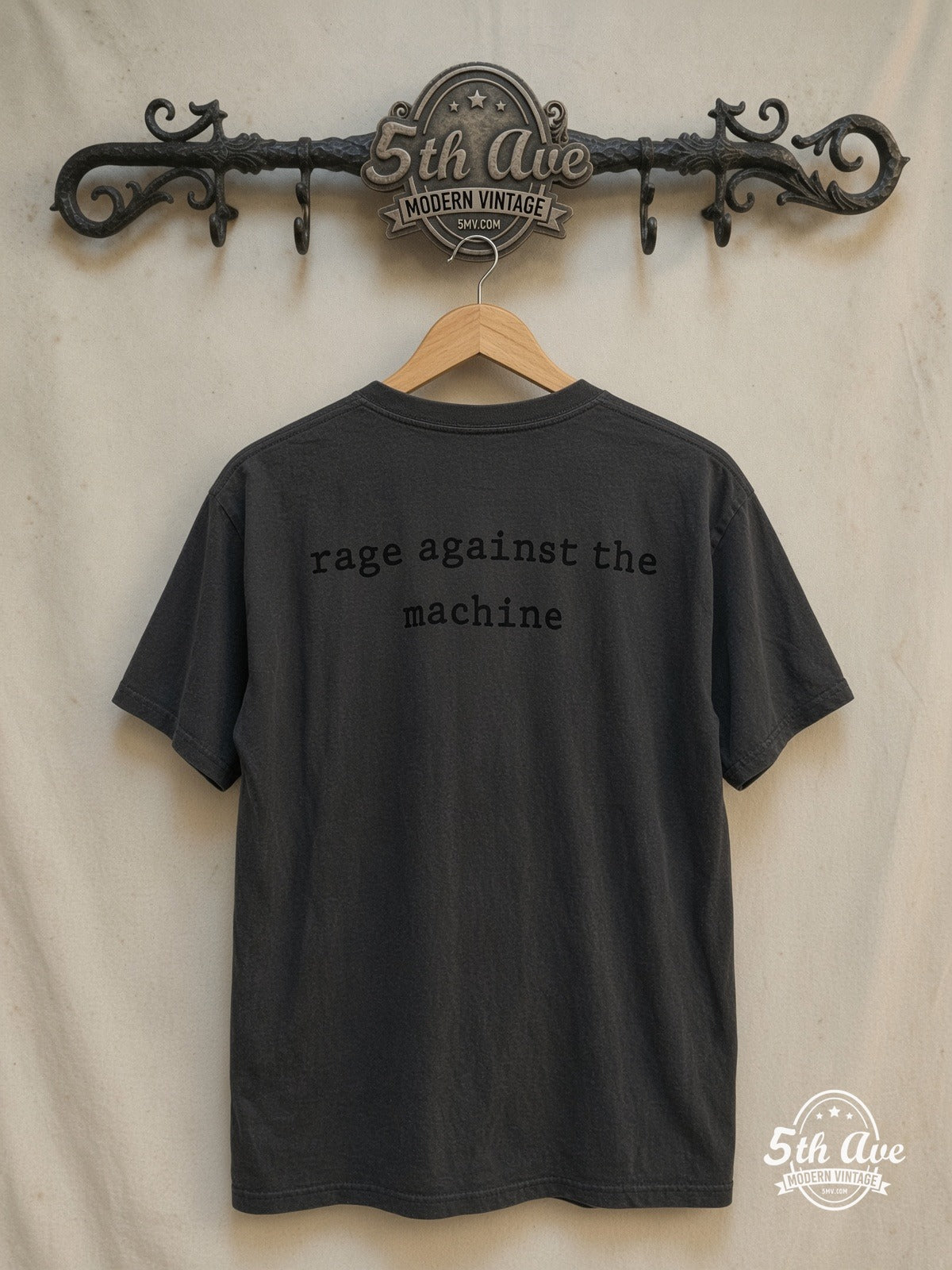 Rage Against the Machine – The Battle of Los Angeles White Fist Silhouette – Vintage Band T-Shirt — back on locked cream ornate 5th Ave rack
