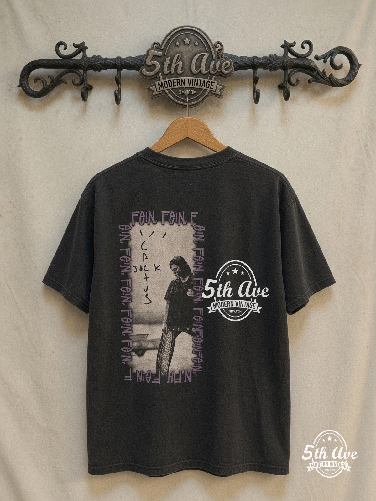 Travis Scott × Stüssy – FEIN / Cactus Jack – Vintage Band T-Shirt — back on locked cream ornate 5th Ave rack