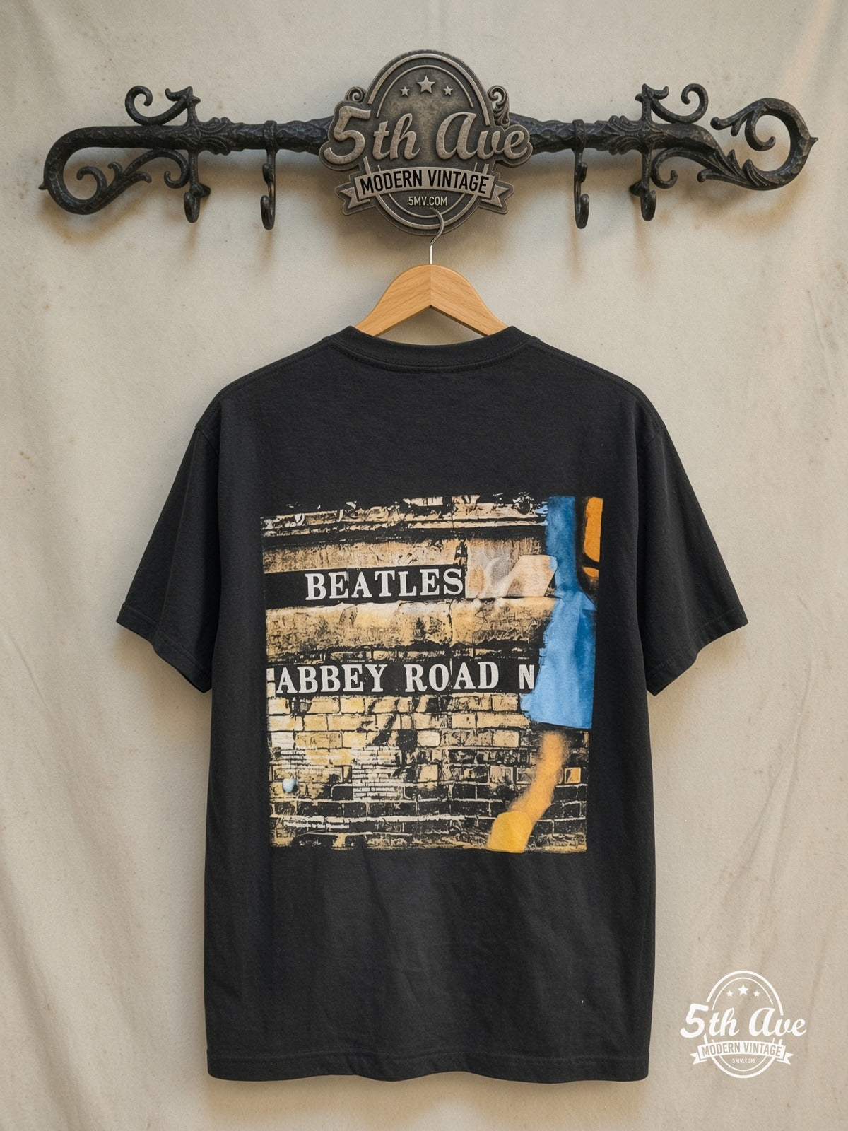 The Beatles – Abbey Road Crossing Wall Sign Back – Vintage Band T-Shirt — back on locked cream ornate 5th Ave rack