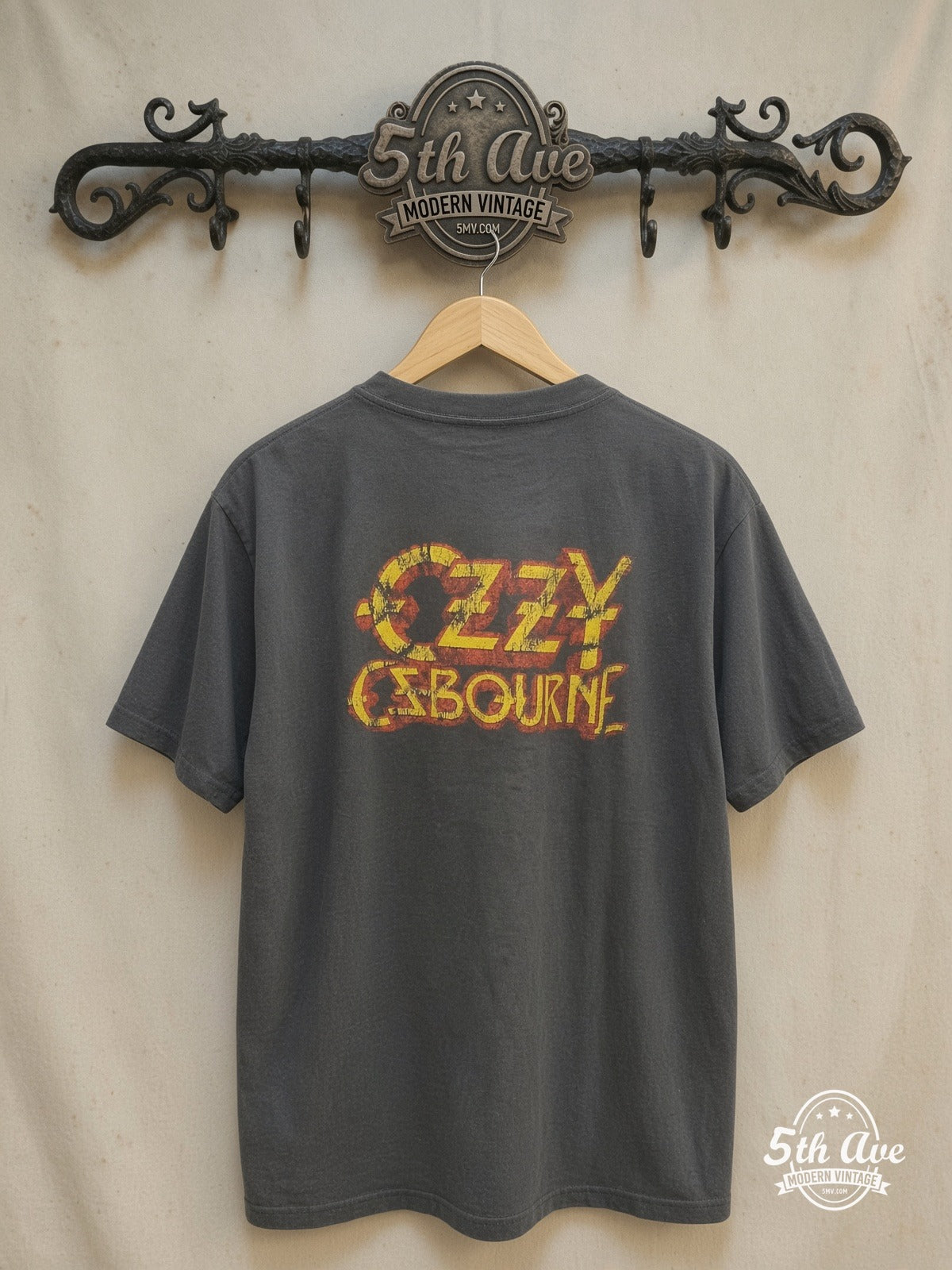 Ozzy Osbourne – The Ultimate – Vintage Band T-Shirt — back on locked cream ornate 5th Ave rack