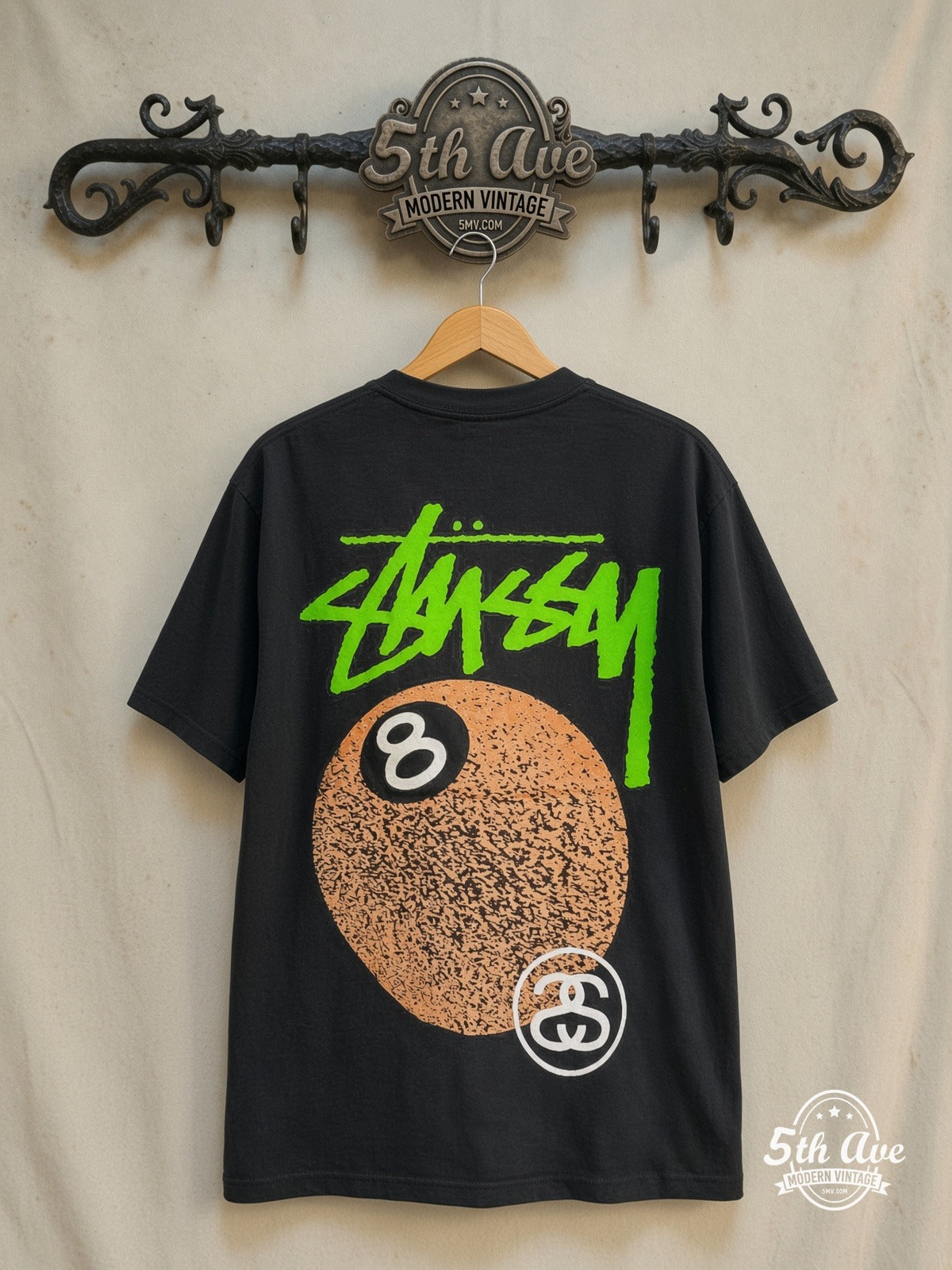 BIG and MEATY x Stüssy BIG and MEATY graphic tee in black, back view on a display rack