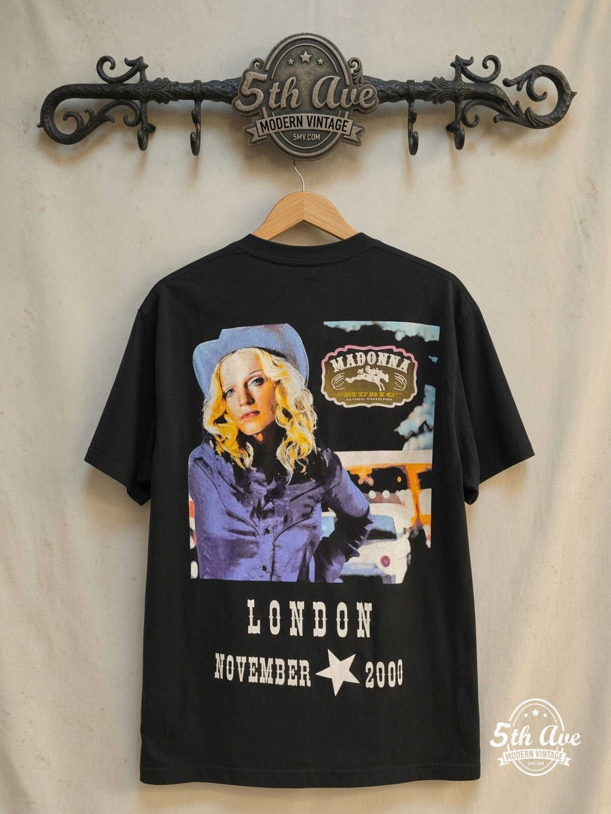 Madonna – Brixton Academy Concert 2000 – Vintage Band T-Shirt — back on locked cream ornate 5th Ave rack