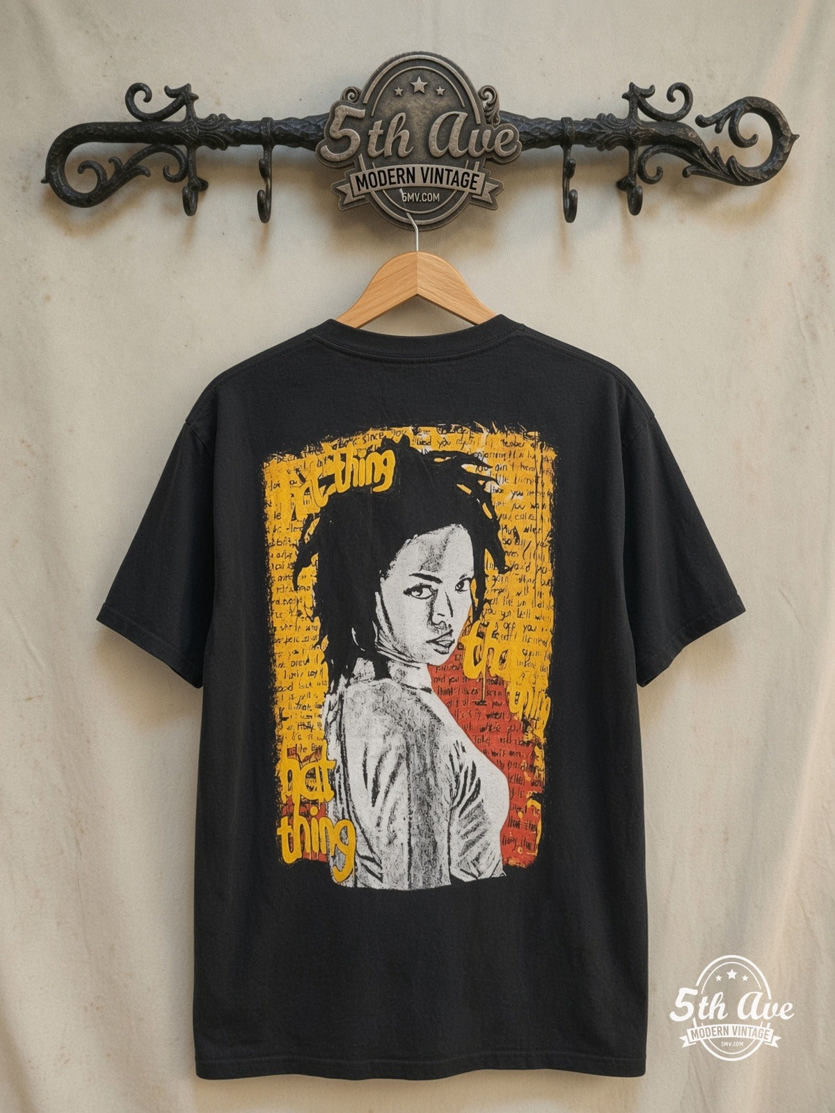Lauryn Hill – The Miseducation of Lauryn Hill – Vintage Band T-Shirt — back on locked cream ornate 5th Ave rack