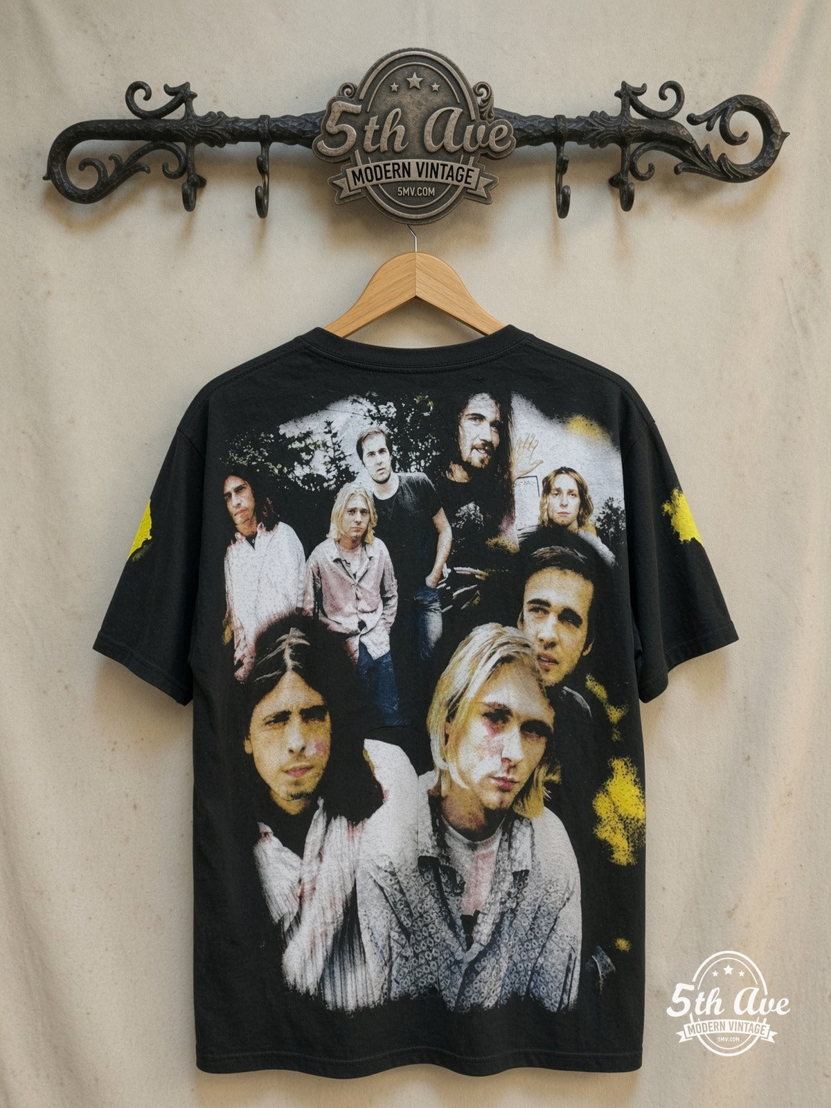 Nirvana – Nirvana – All Over Print – Vintage Band T-Shirt — back on locked cream ornate 5th Ave rack