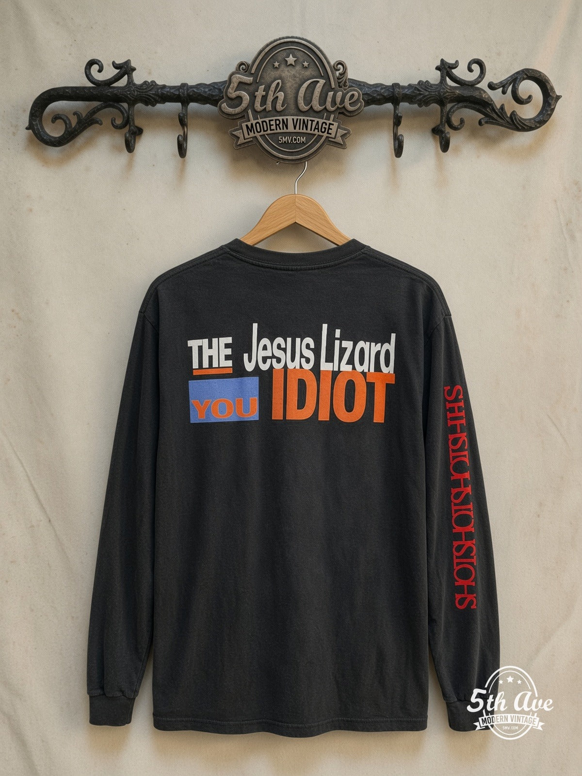 The Jesus Lizard – You Idiot – Vintage Band T-Shirt — back on locked cream ornate 5th Ave rack