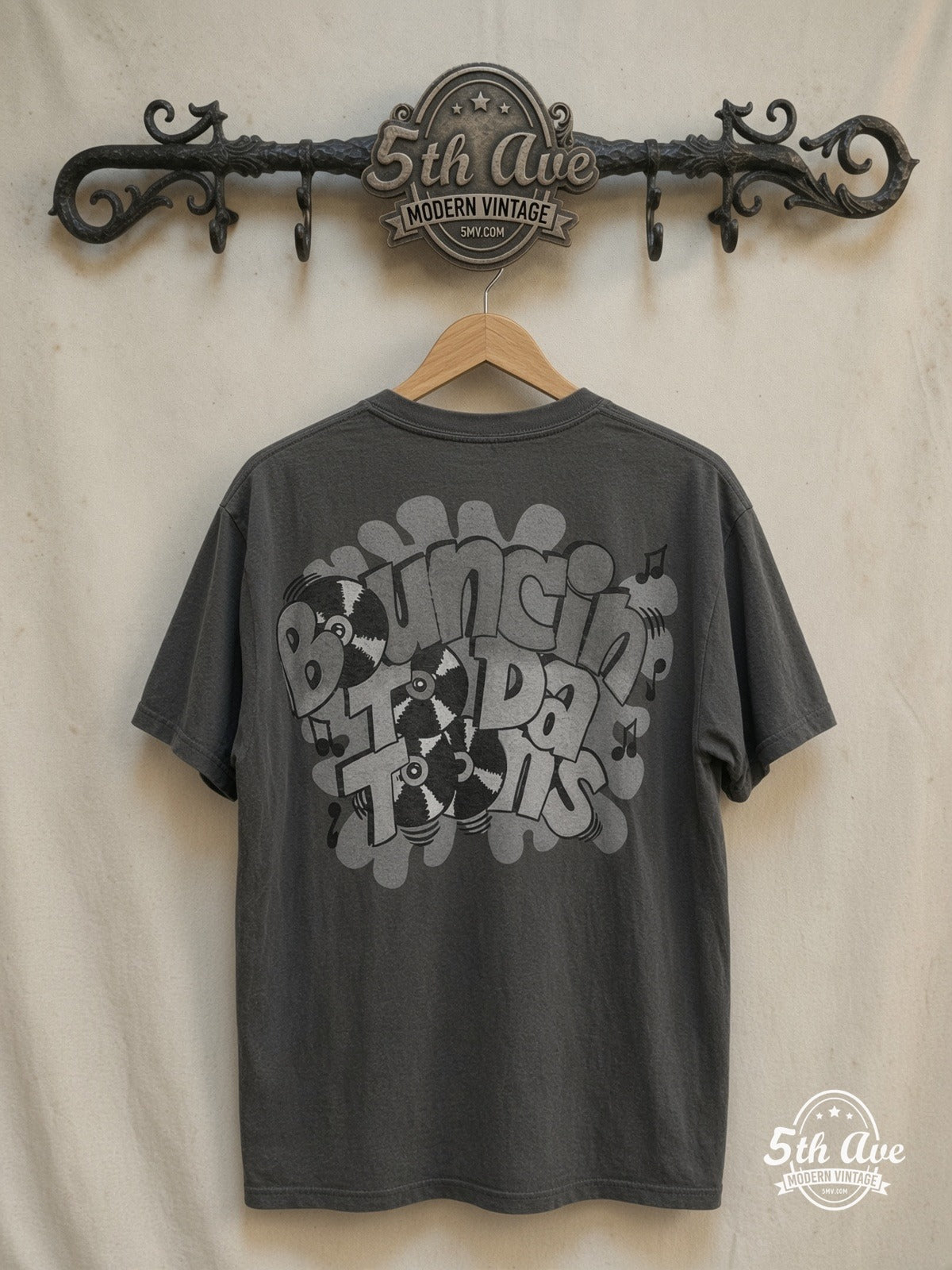 Looney Tunes – All Over Print T-Shirt – New Vintage Graphic Tee — back on locked cream ornate 5th Ave rack