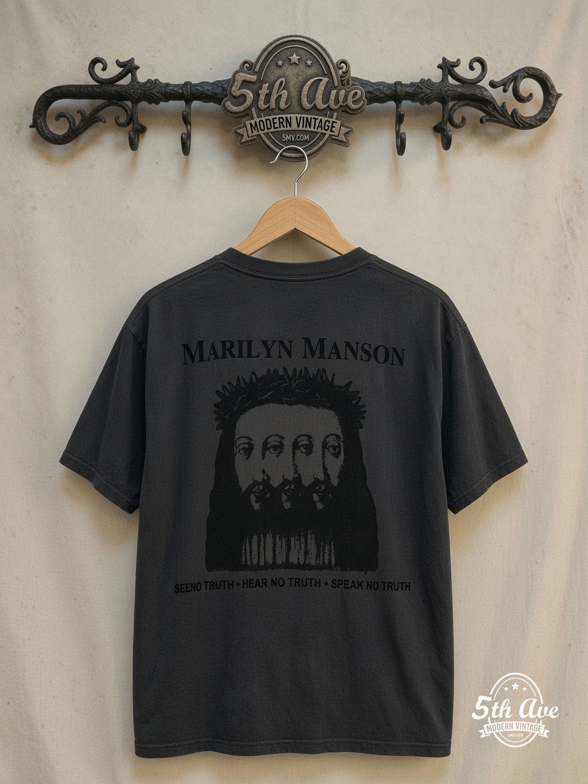 Marilyn Manson – Believe – Vintage Band T-Shirt — back on locked cream ornate 5th Ave rack