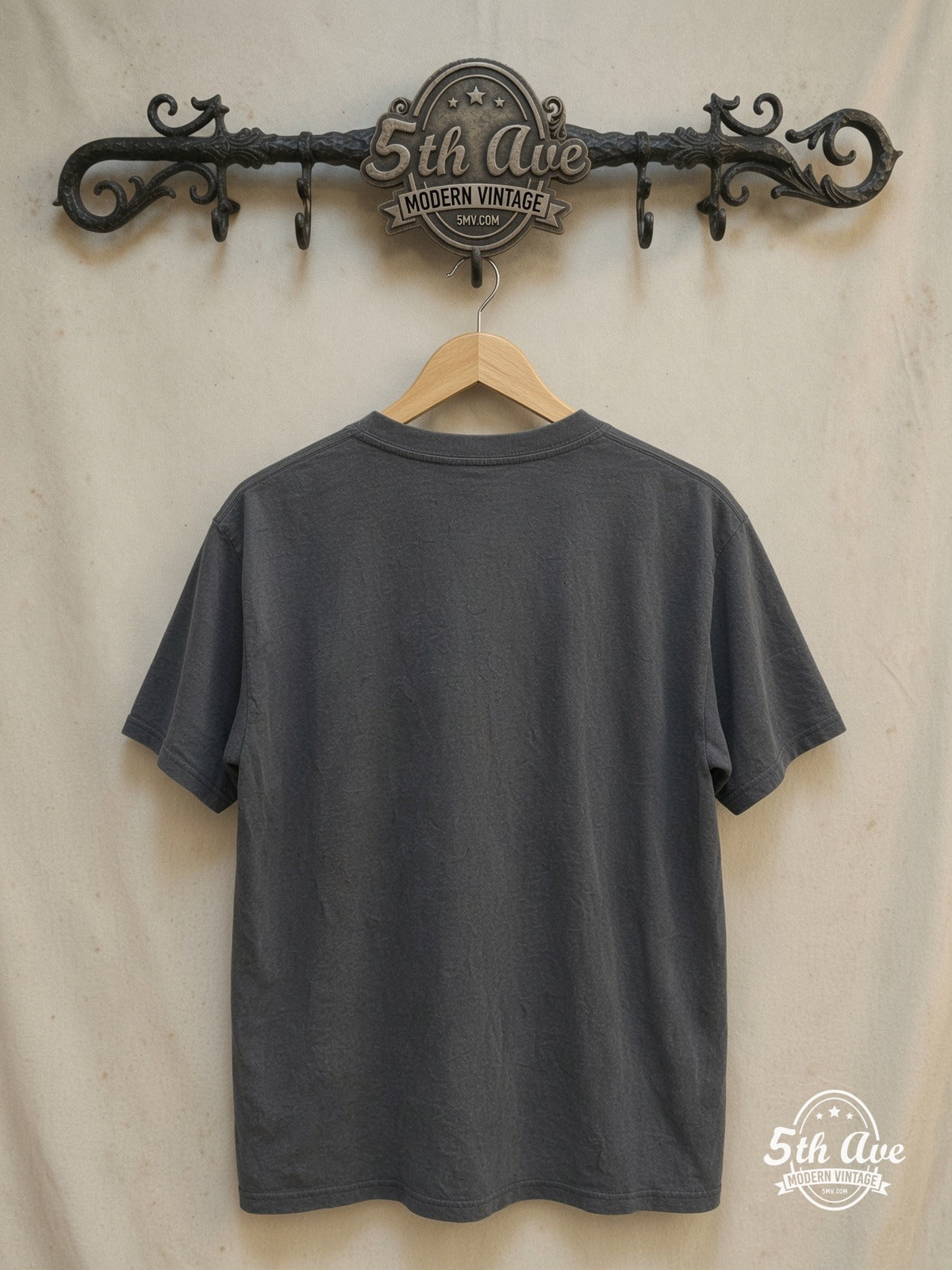 The Kinks – Vintage Band T-Shirt — back on locked cream ornate 5th Ave rack