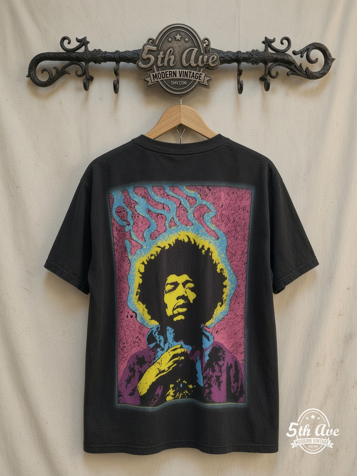 Jimi Hendrix – Psychedelic Yellow Portrait Pink Frame – Vintage Band T-Shirt — back on locked cream ornate 5th Ave rack