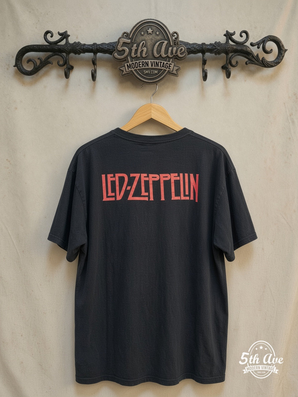 Led Zeppelin – Inglewood California Concert – Vintage Band T-Shirt — back on locked cream ornate 5th Ave rack