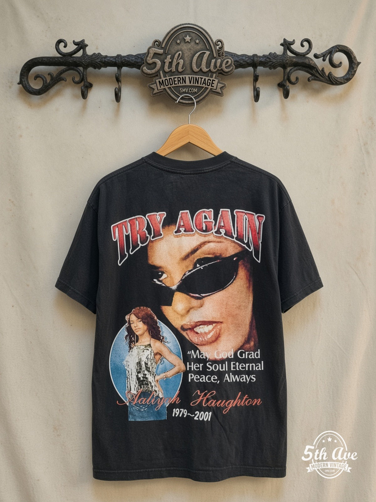 Aaliyah – Try Again – Vintage Band T-Shirt — back on locked cream ornate 5th Ave rack