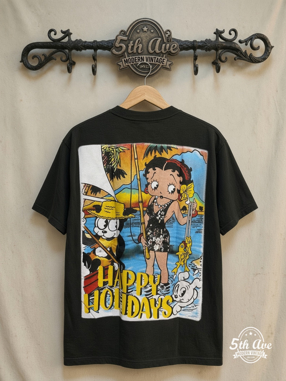 Betty Boop – Happy Holidays - AOP all over print New Vintage Animation T-Shirt – New Vintage Graphic Tee — back on locked cream ornate 5th Ave rack