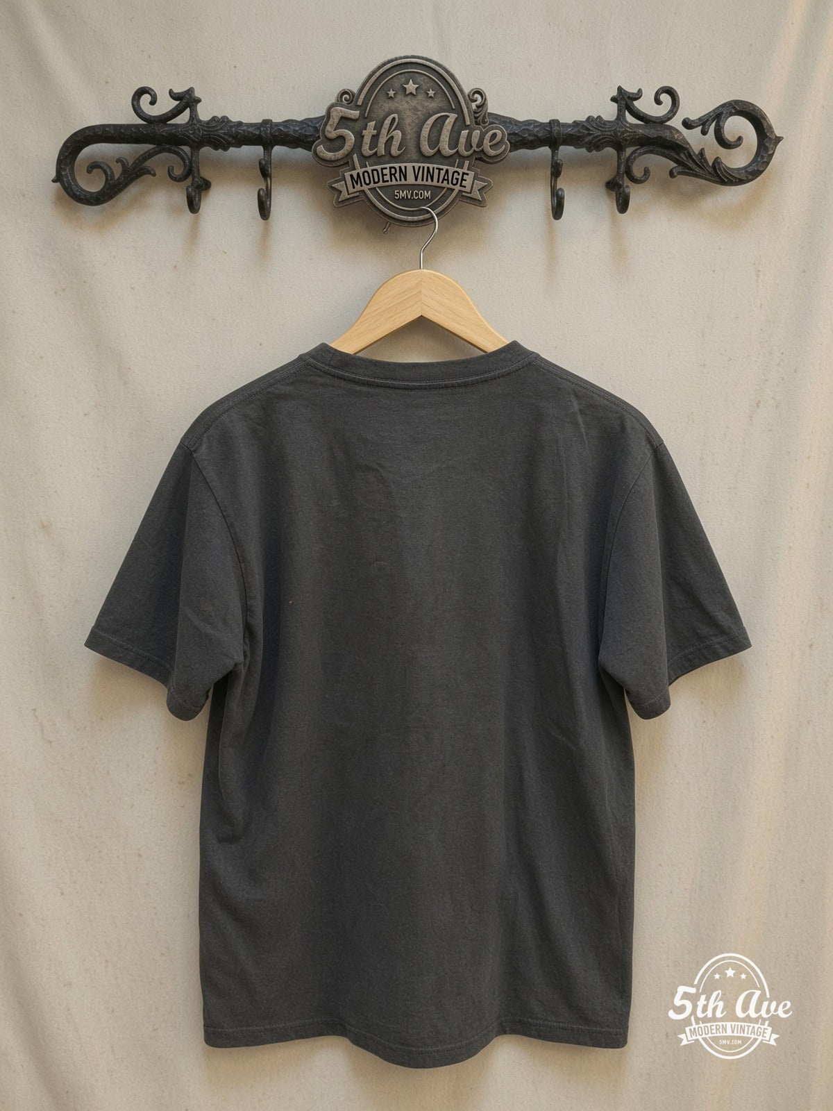 Led Zeppelin – Tribute with Zoso Logos – Vintage Band T-Shirt — back on locked cream ornate 5th Ave rack