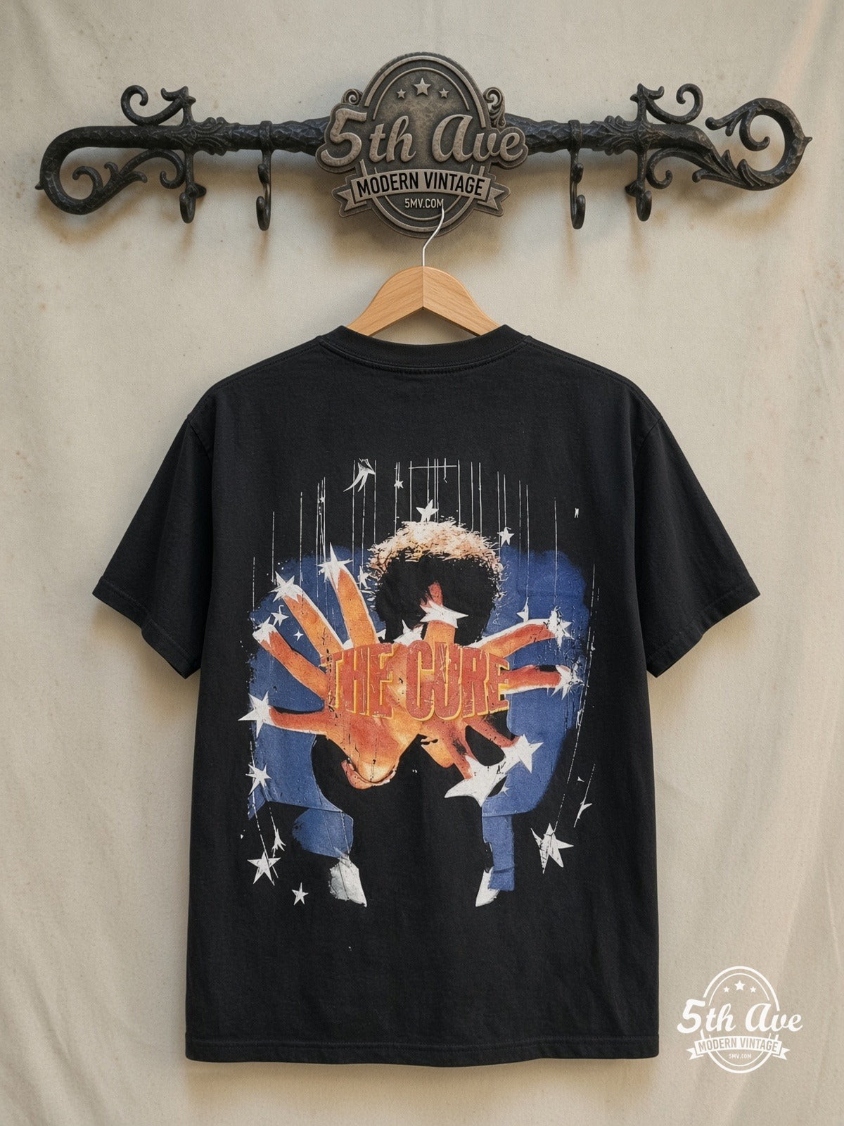 The Cure – Greatest Hits – Vintage Band T-Shirt — back on locked cream ornate 5th Ave rack