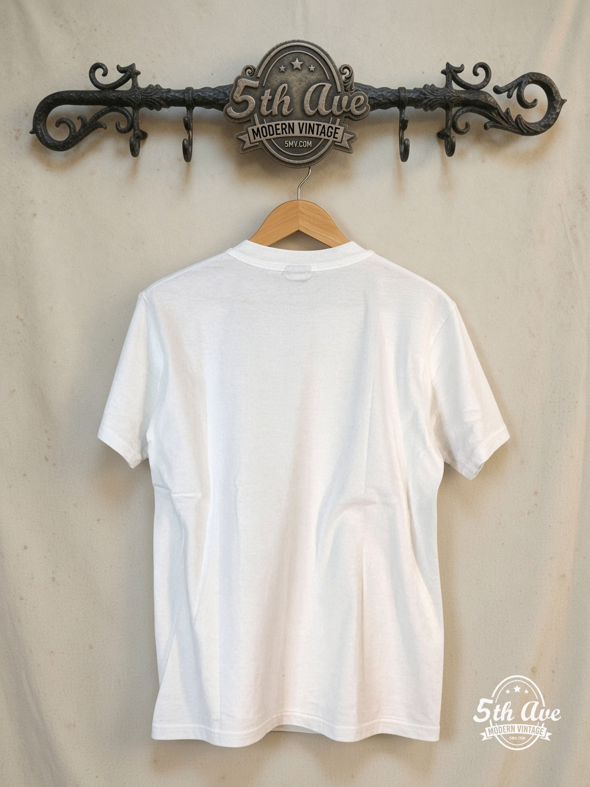 Nirvana – Classic Rock Band Graphic – Vintage Band T-Shirt — back on locked cream ornate 5th Ave rack