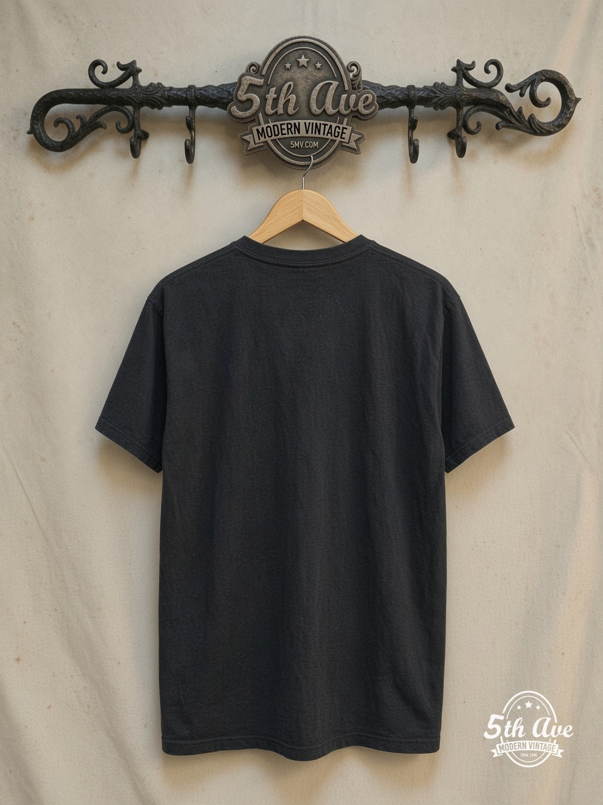 Pink Floyd – Another Brick In the Wall – Vintage Band T-Shirt — back on locked cream ornate 5th Ave rack