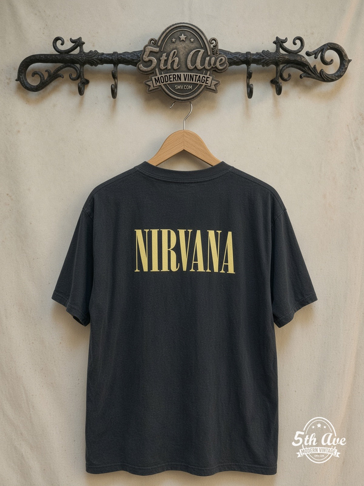 Nirvana – Kurt Cobain Drum Jump Live – Vintage Band T-Shirt — back on locked cream ornate 5th Ave rack