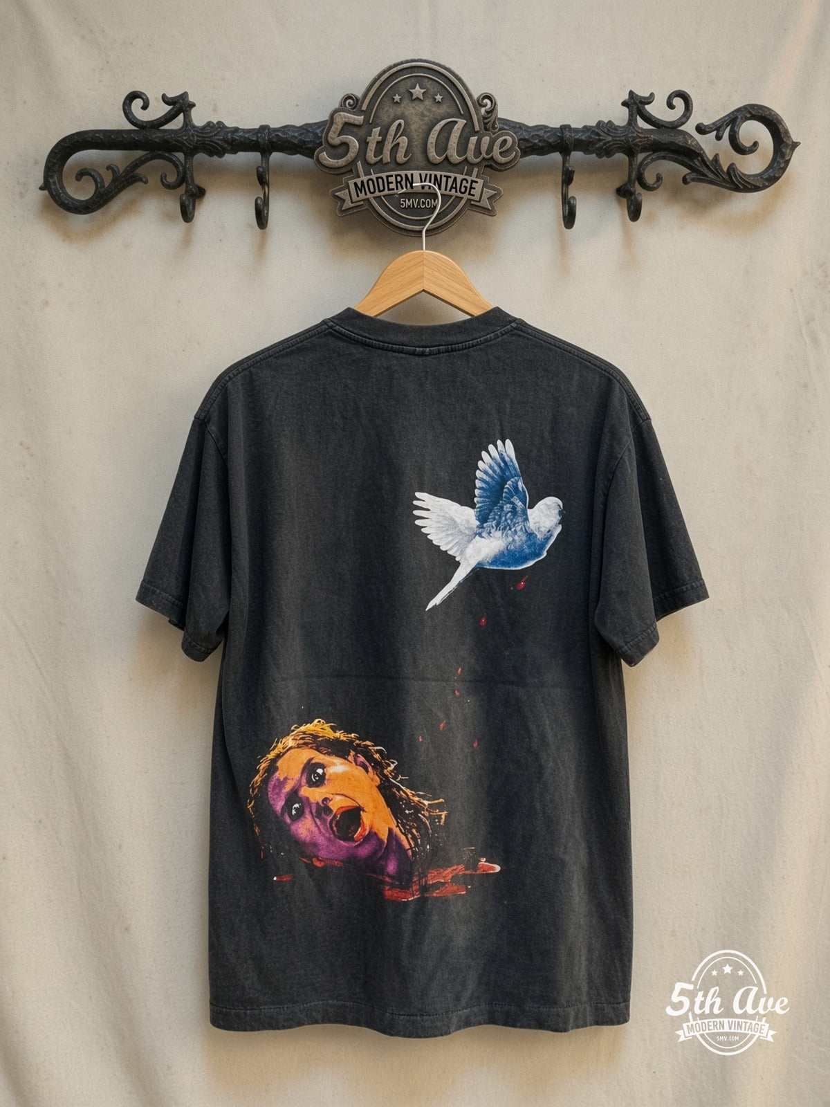Ozzy Osbourne – Dove Mic Blue Portrait Severed Head – Vintage Band T-Shirt — back on locked cream ornate 5th Ave rack
