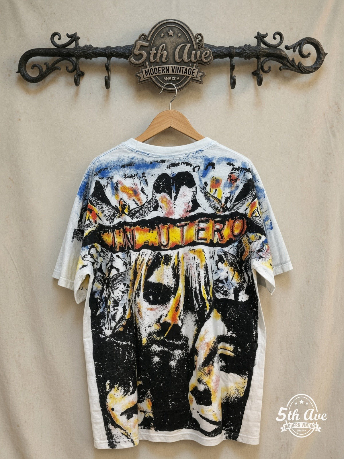 Nirvana – In Utero – All Over Print – Vintage Band T-Shirt — back on locked cream ornate 5th Ave rack